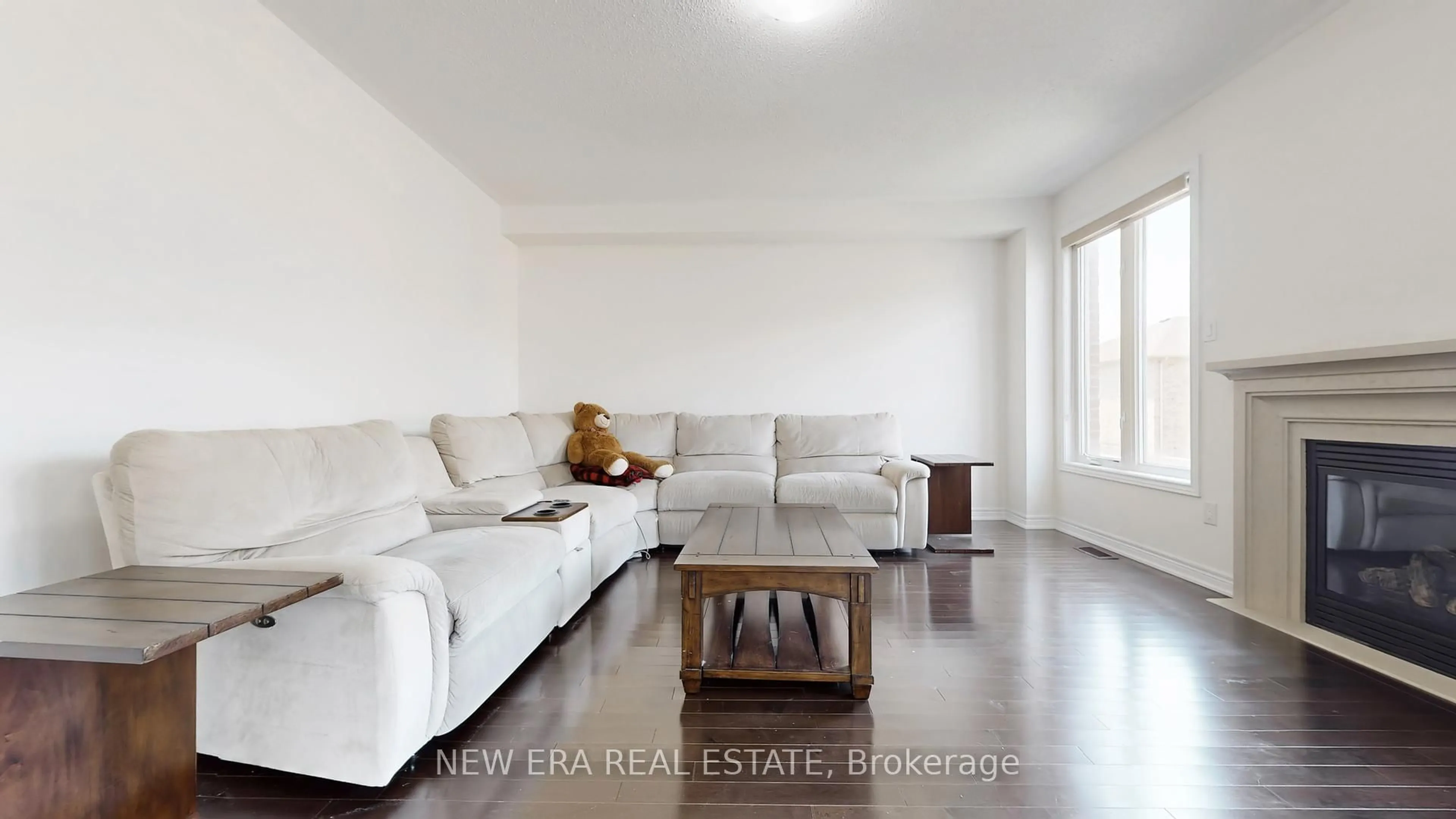 Living room with furniture, wood/laminate floor for 8 Hubner Ave, Markham Ontario L6C 0S8