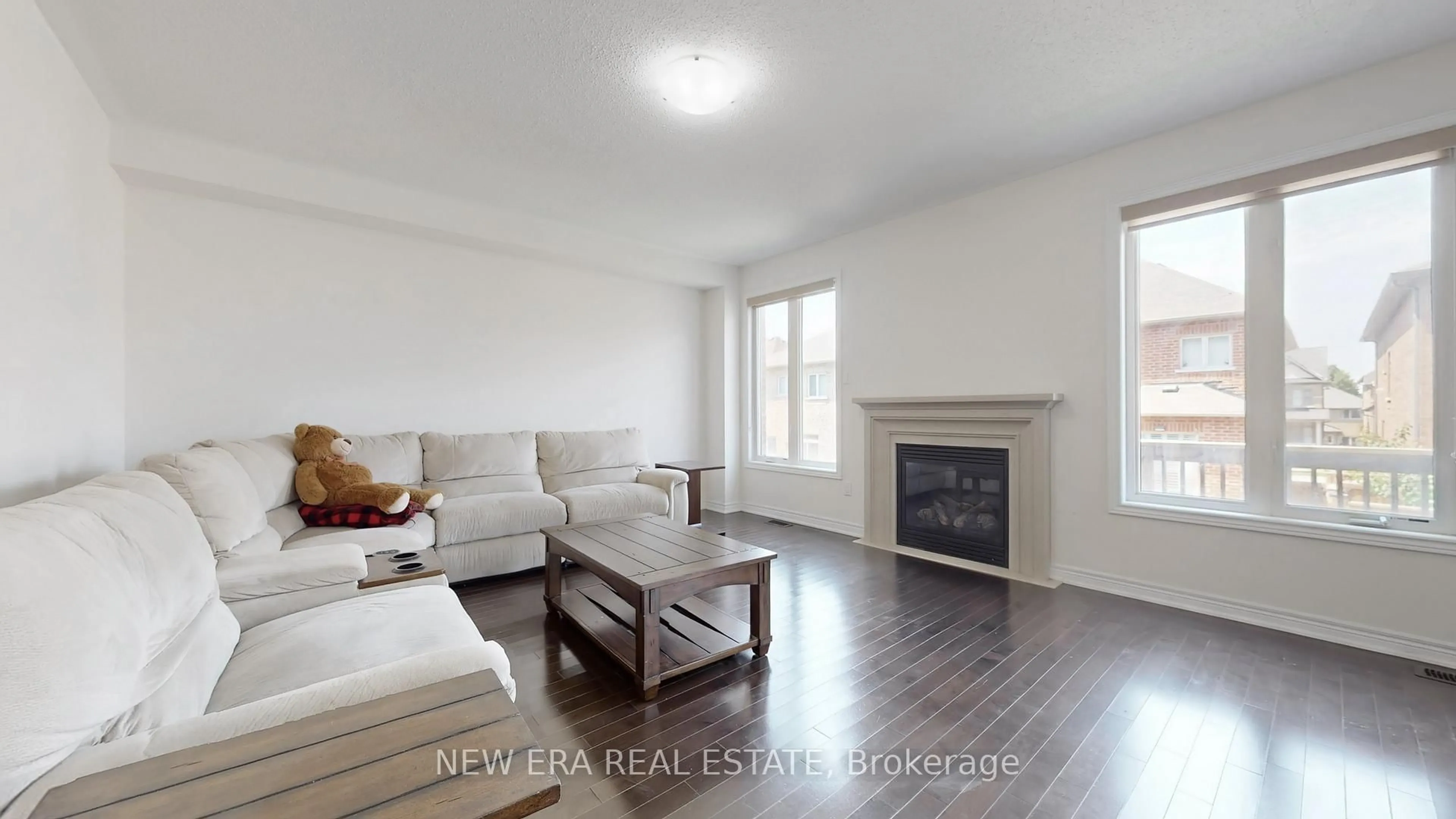Living room with furniture, wood/laminate floor for 8 Hubner Ave, Markham Ontario L6C 0S8