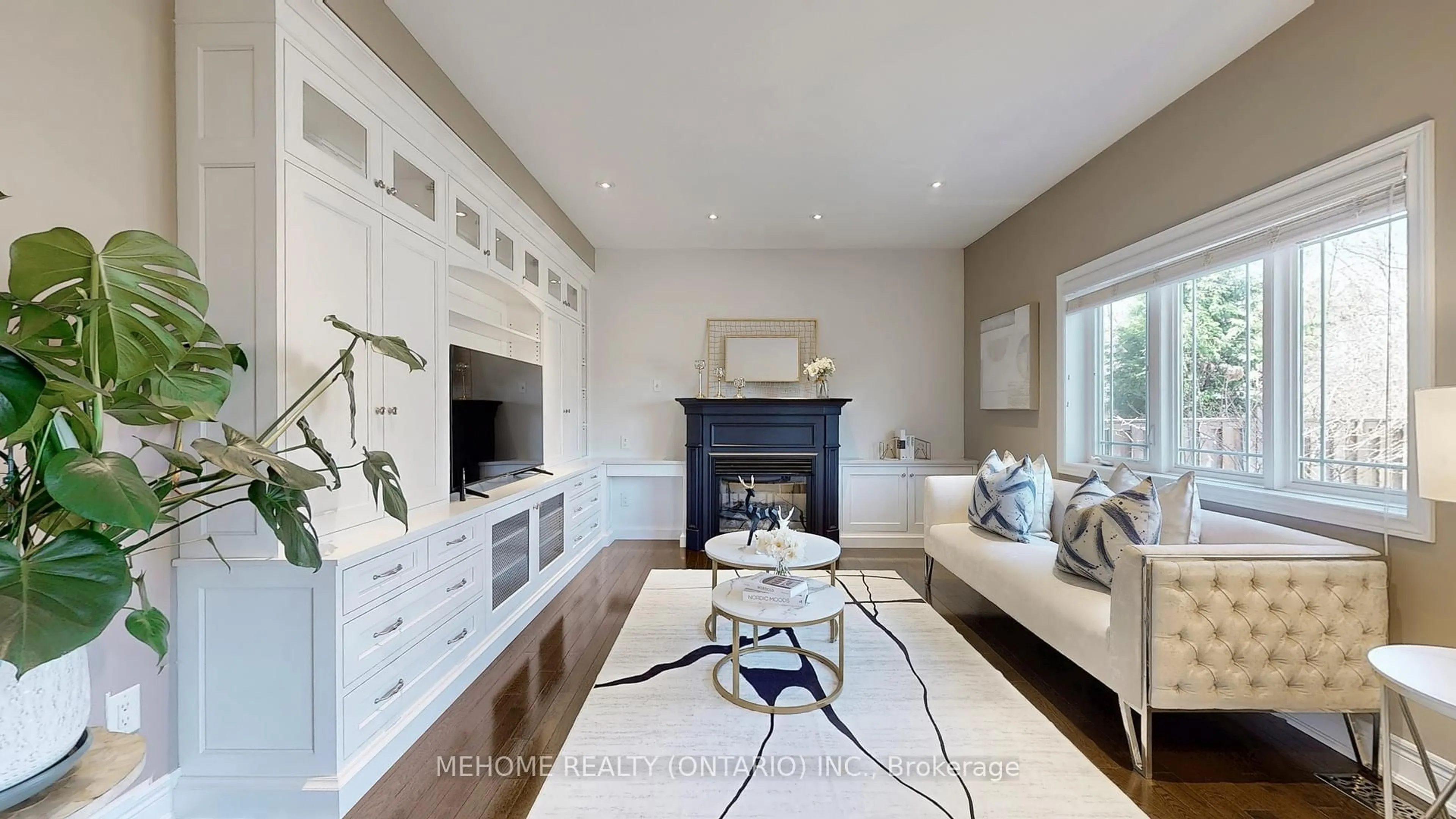 Living room with furniture, wood/laminate floor for 1143 Quaker Tr, Newmarket Ontario L3X 3E2