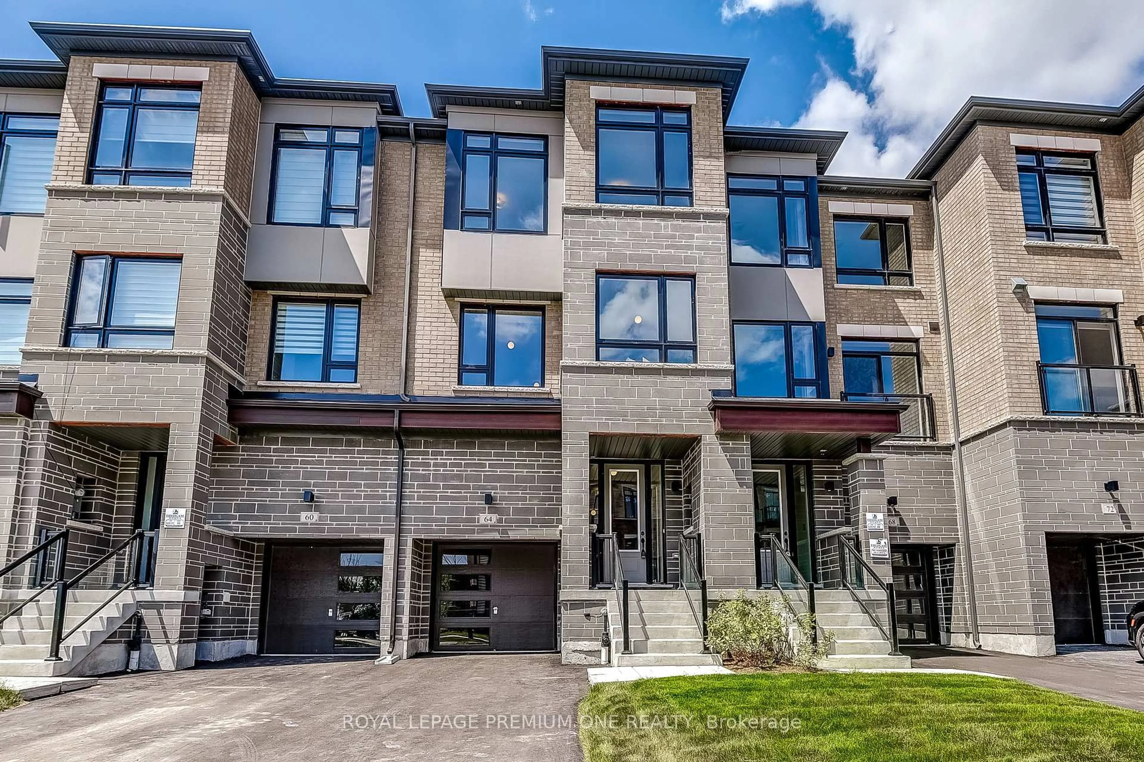Home with brick exterior material, street for 64 TENNANT Circ, Vaughan Ontario L4H 5L4