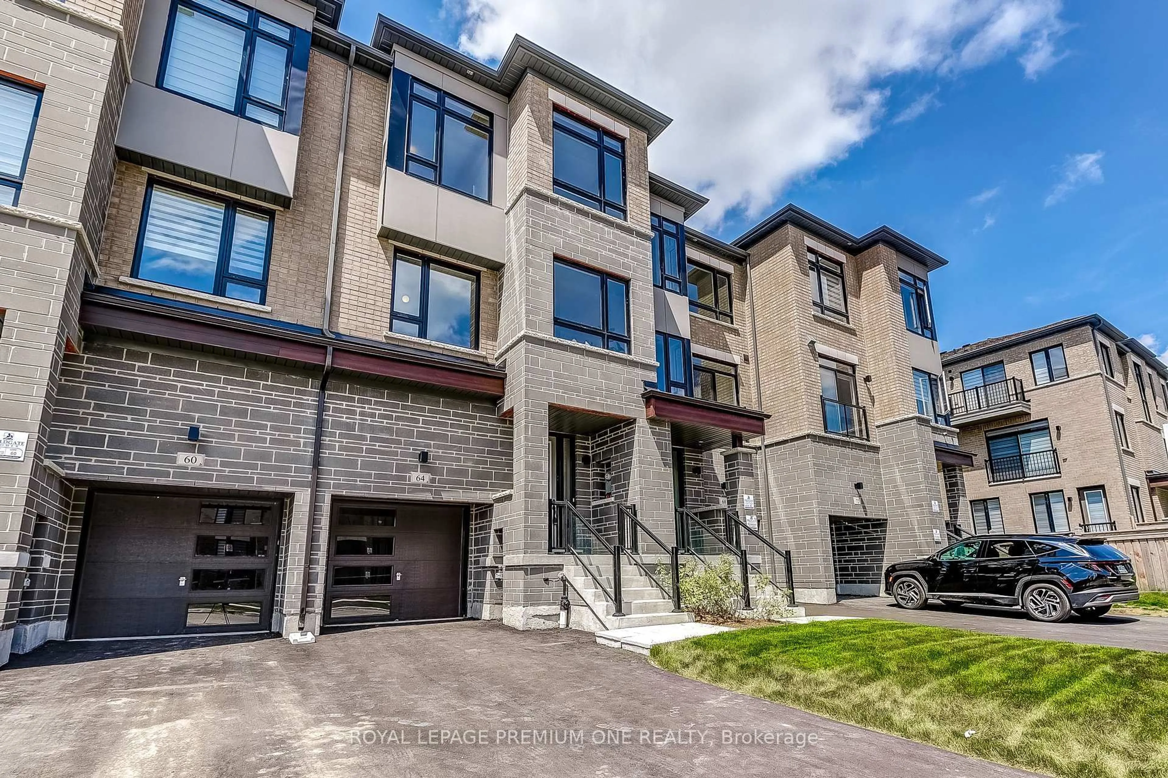 Home with brick exterior material, street for 64 TENNANT Circ, Vaughan Ontario L4H 5L4