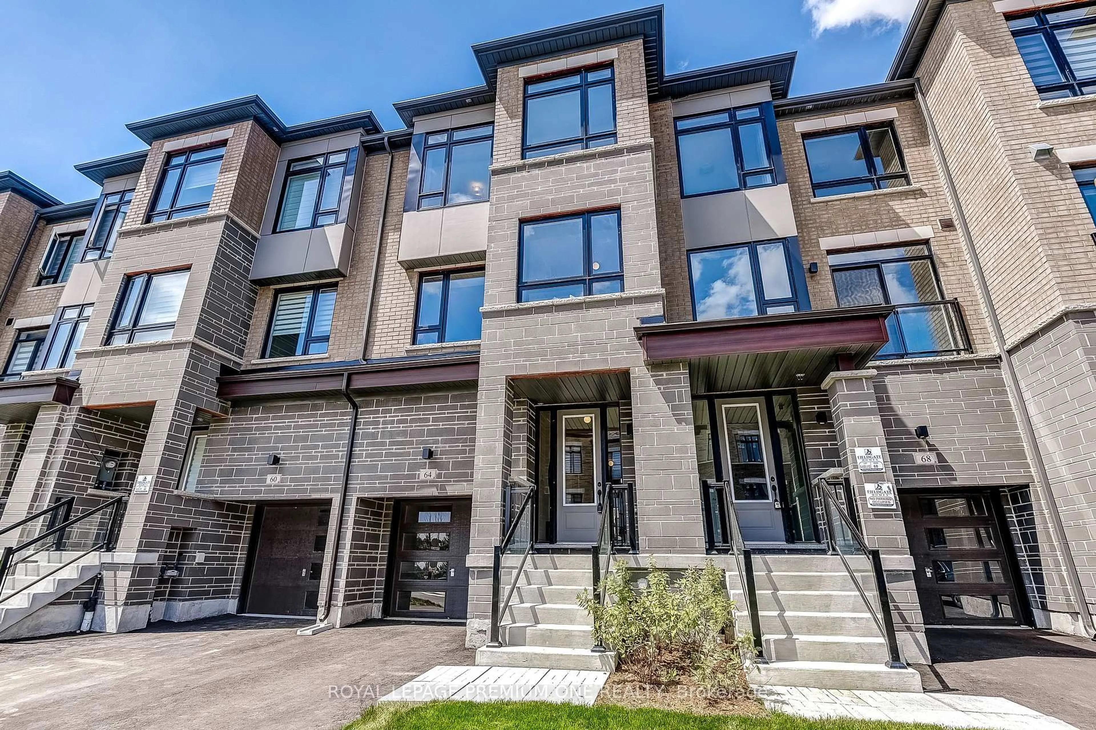 Home with brick exterior material, street for 64 TENNANT Circ, Vaughan Ontario L4H 5L4