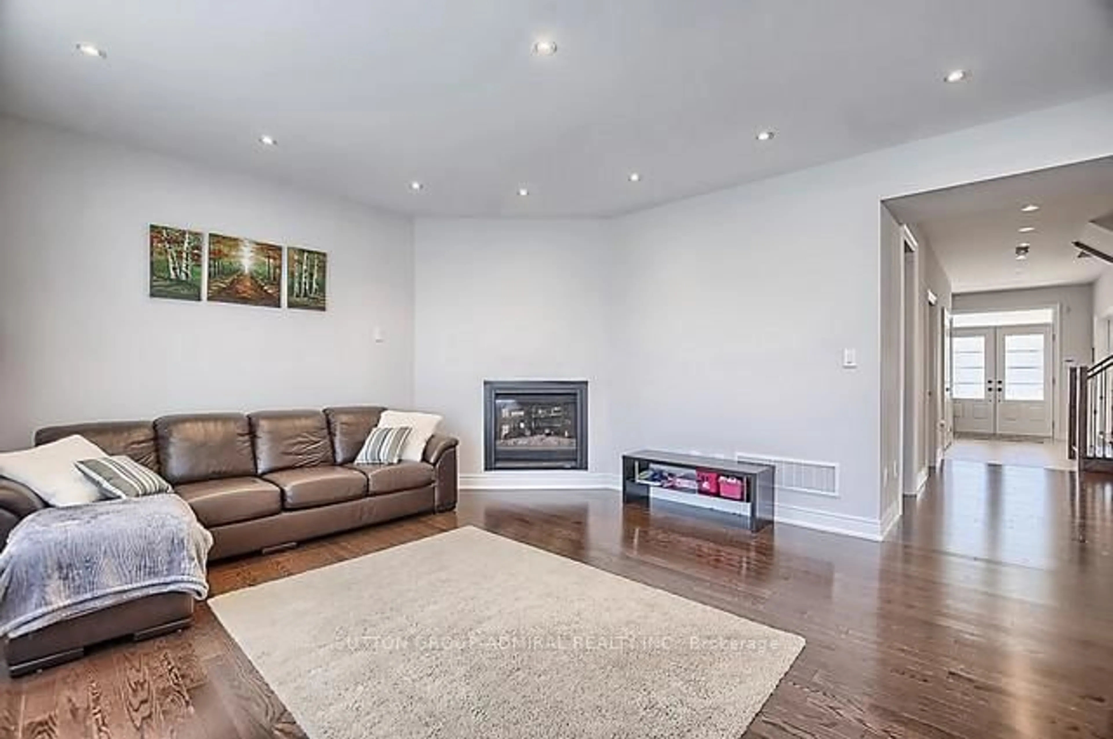Living room with furniture, wood/laminate floor for 1310 Butler St, Innisfil Ontario L9S 0L4