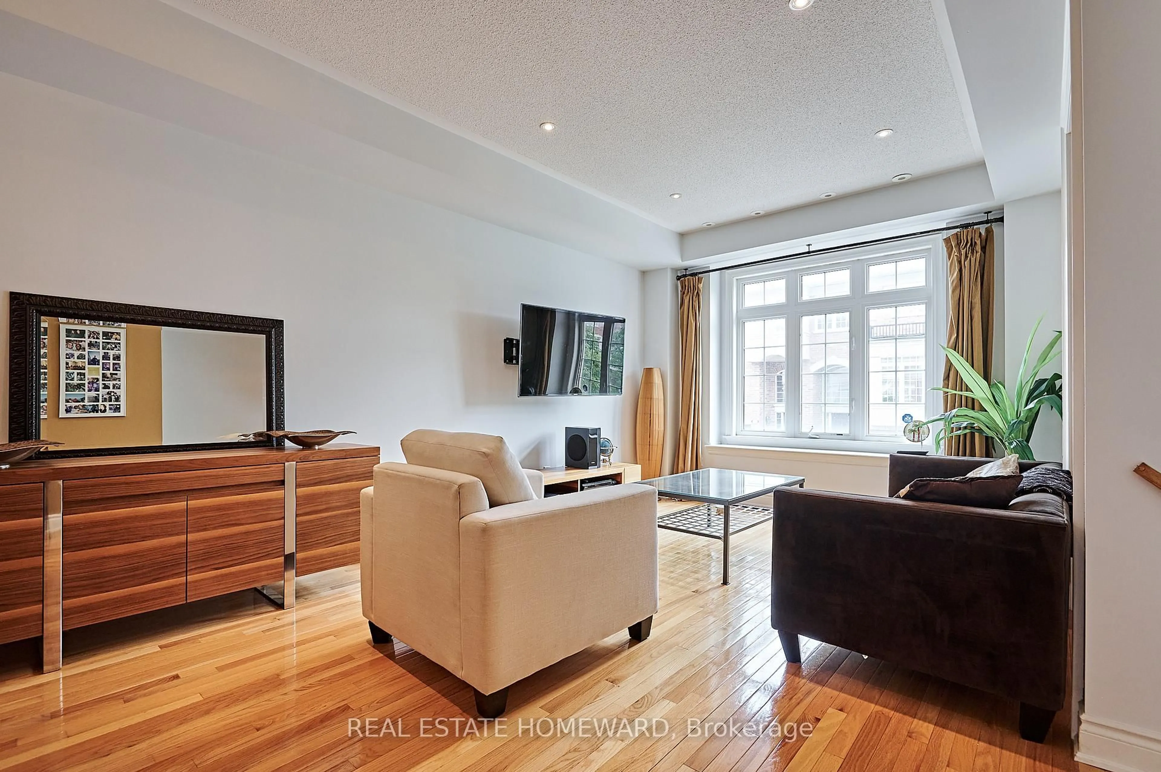 Living room with furniture, wood/laminate floor for 4 Isaac Devins Ave, Vaughan Ontario L4L 0A4