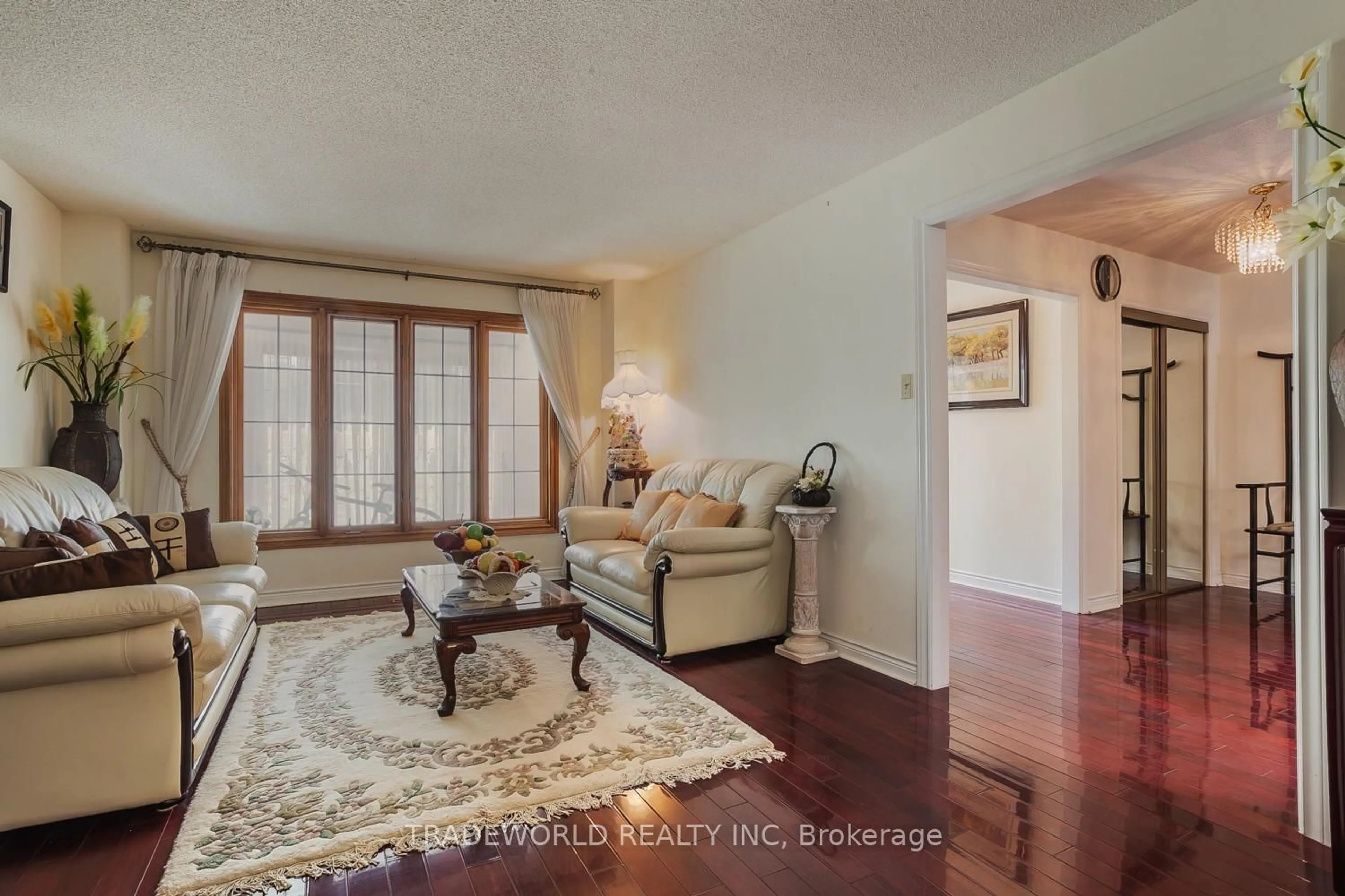 Living room with furniture, wood/laminate floor for 2 Doulton Crt, Markham Ontario L3R 8N8