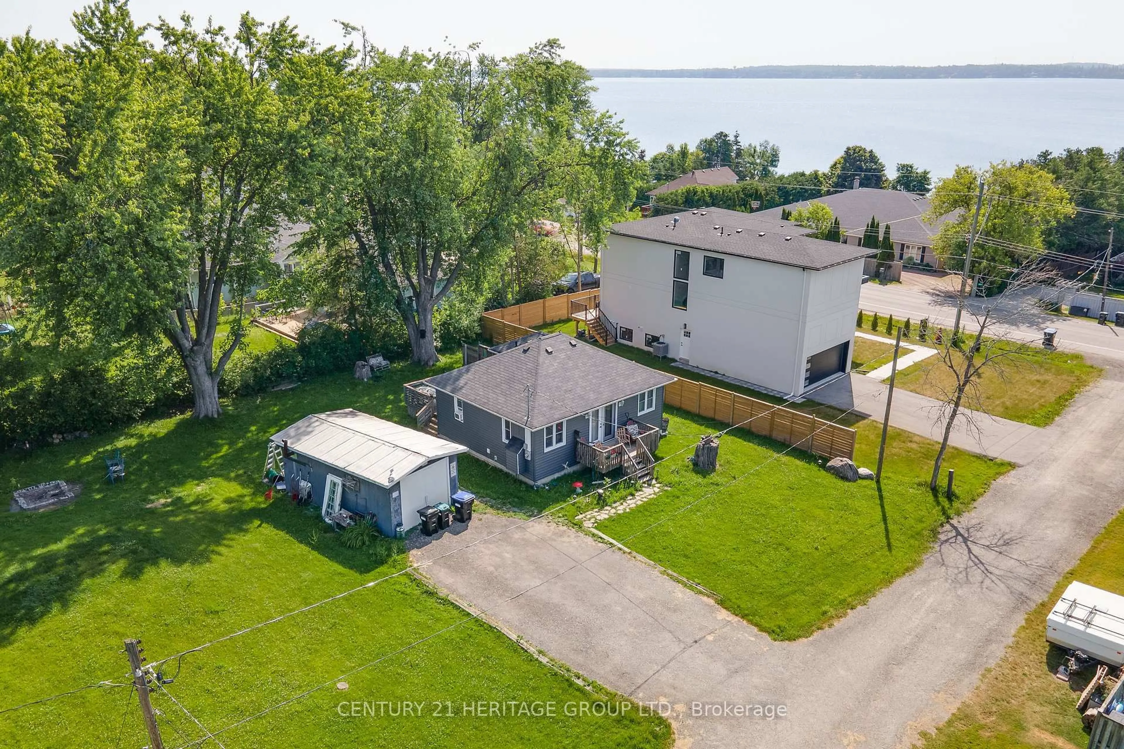 A pic from outside/outdoor area/front of a property/back of a property/a pic from drone, water/lake/river/ocean view for 1417 Maple Way, Innisfil Ontario L0L 1C0