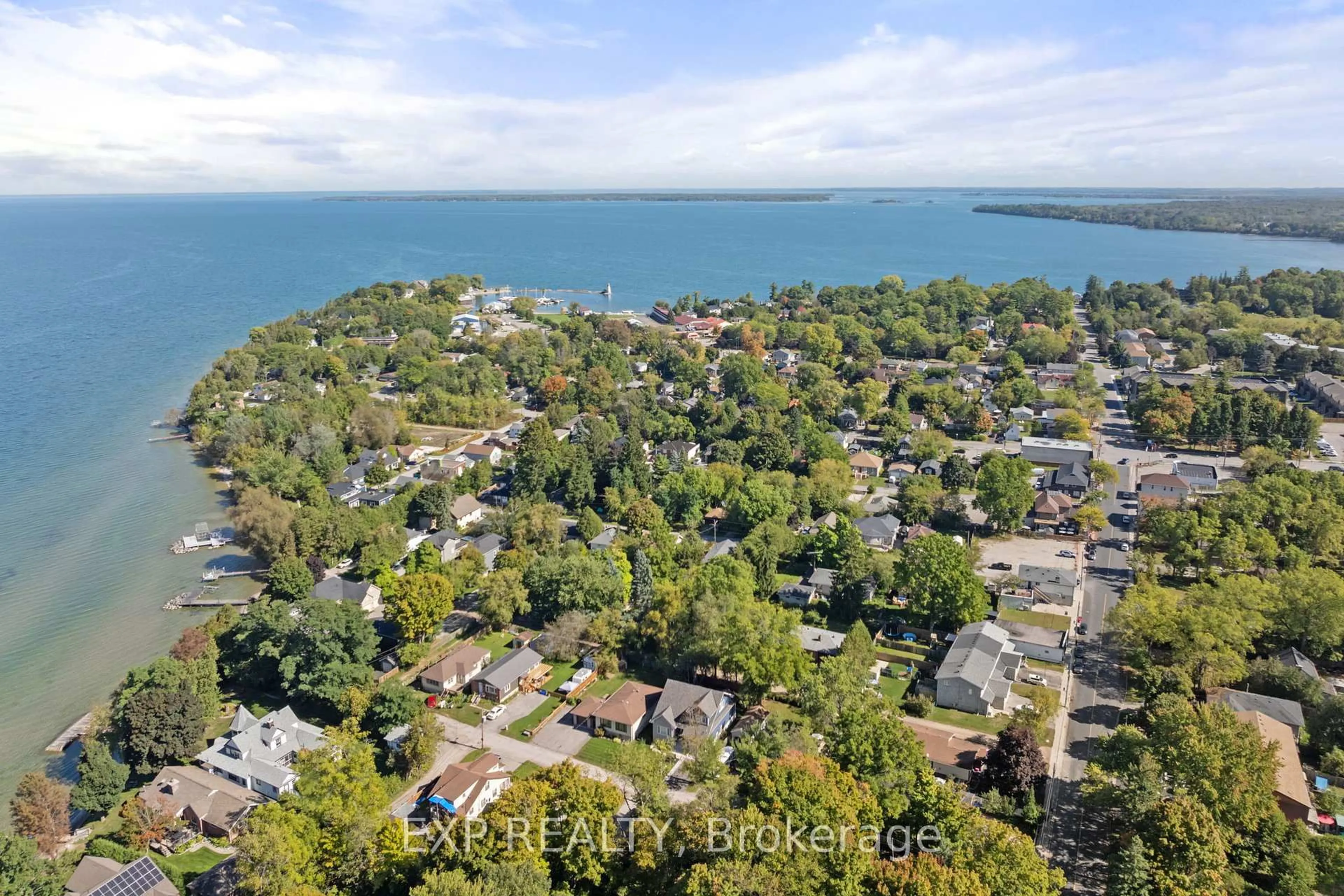 A pic from outside/outdoor area/front of a property/back of a property/a pic from drone, water/lake/river/ocean view for 9 Riley Ave, Georgina Ontario L0E 1L0
