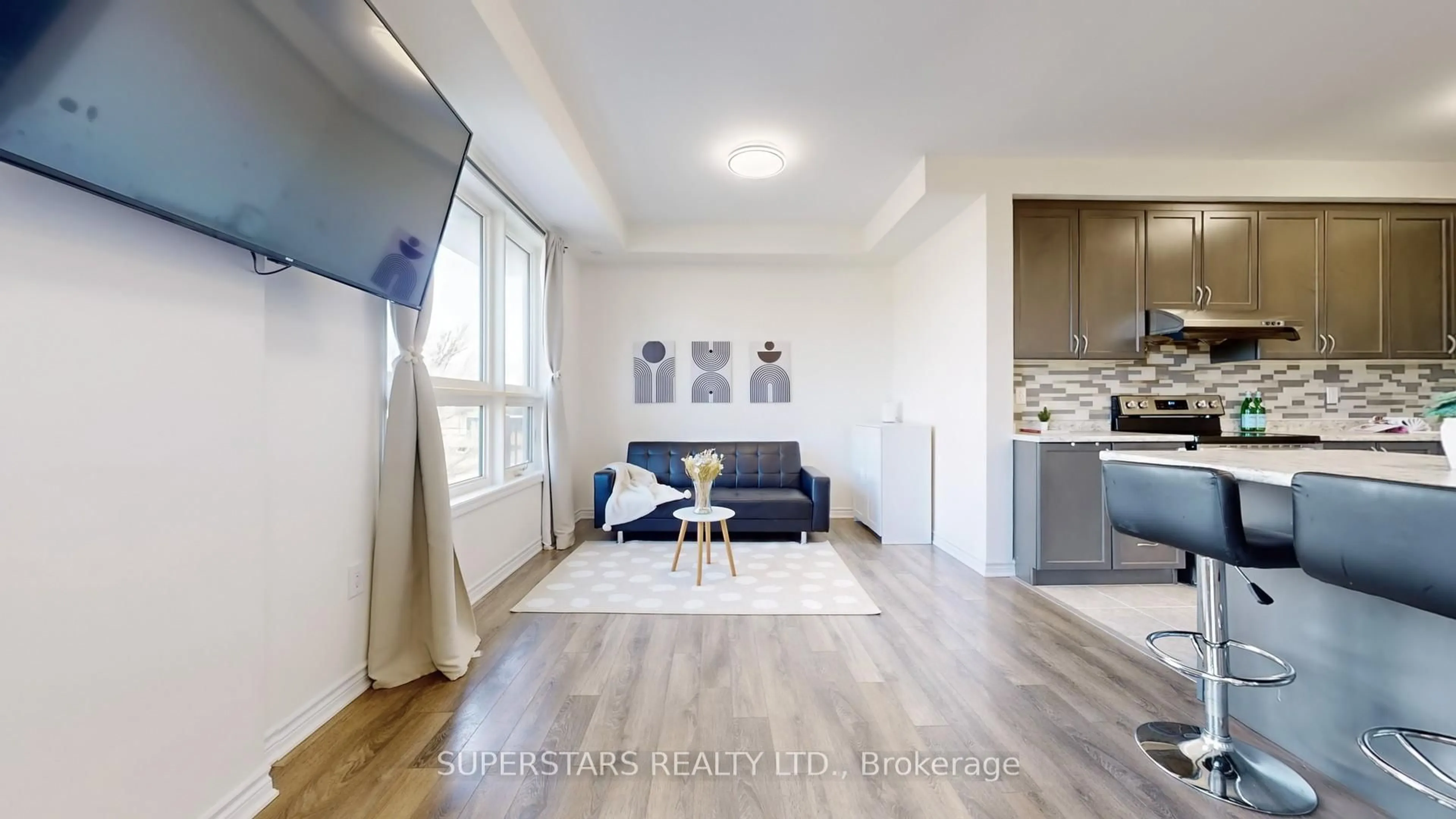 Living room with furniture, wood/laminate floor for 360 Arthur Bonner Ave, Markham Ontario L6B 1N2
