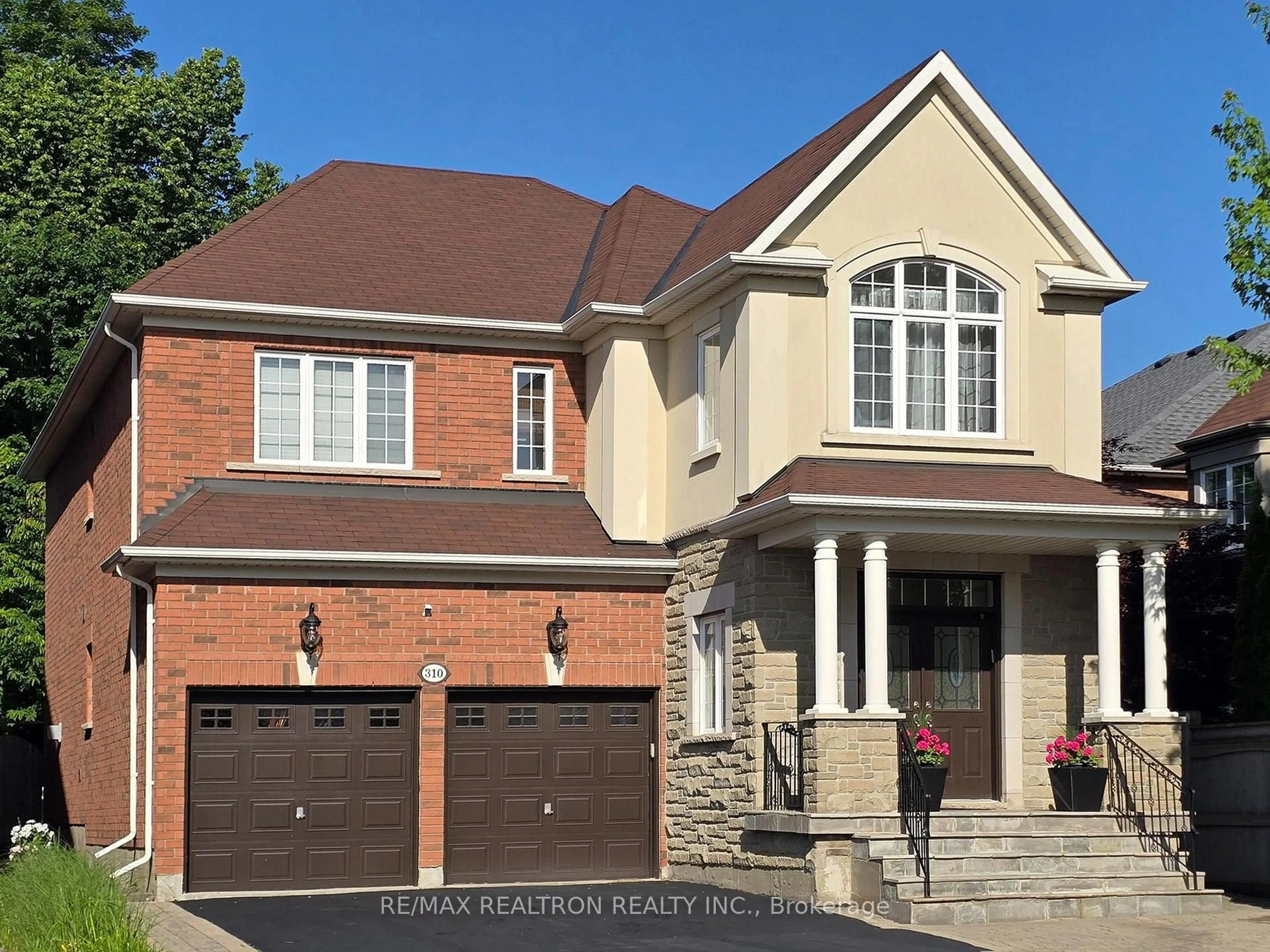 Home with brick exterior material, street for 310 Thornhill Woods Dr, Vaughan Ontario L4J 8V6