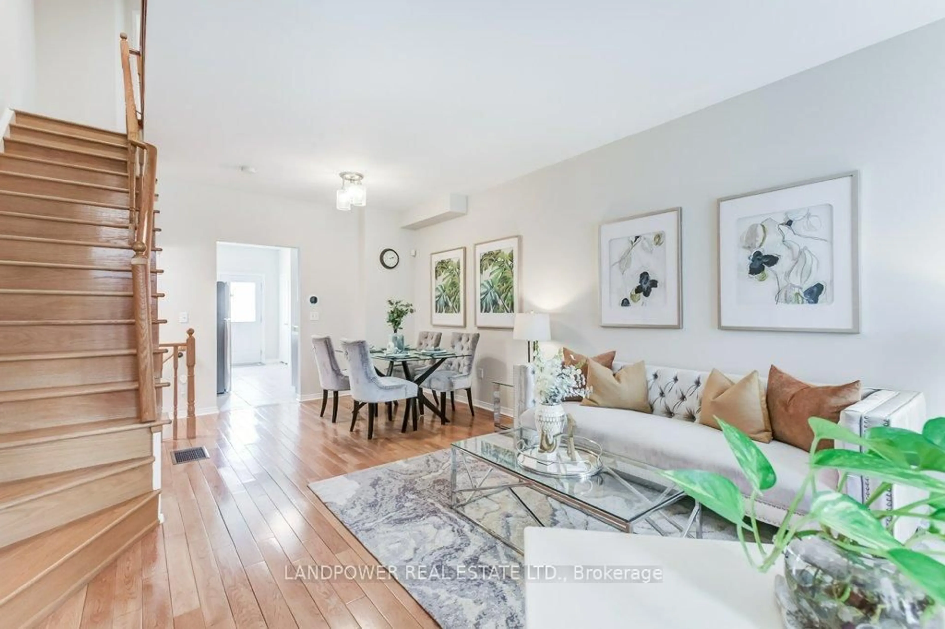 Living room with furniture, wood/laminate floor for 165 Bur Oak Ave, Markham Ontario L6C 2G1