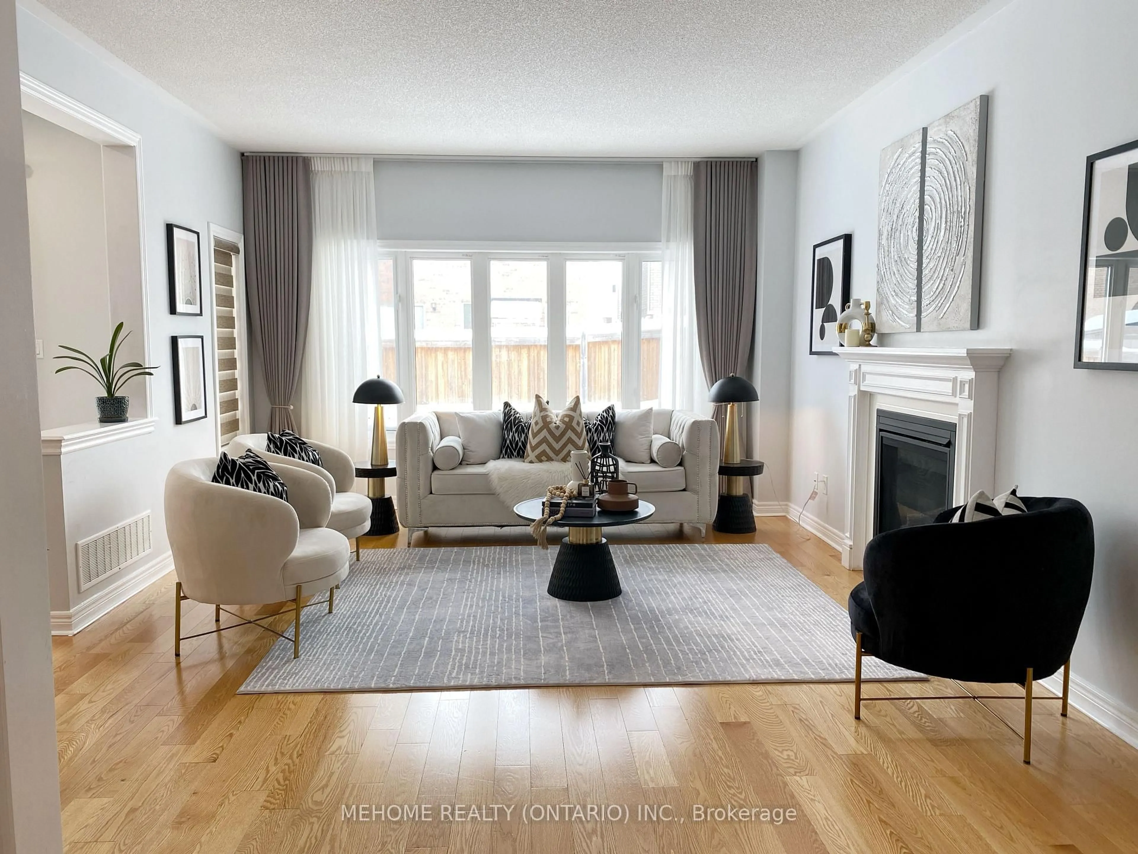 Living room with furniture, wood/laminate floor for 138 Romanelli Cres, Bradford West Gwillimbury Ontario L3Z 0X7