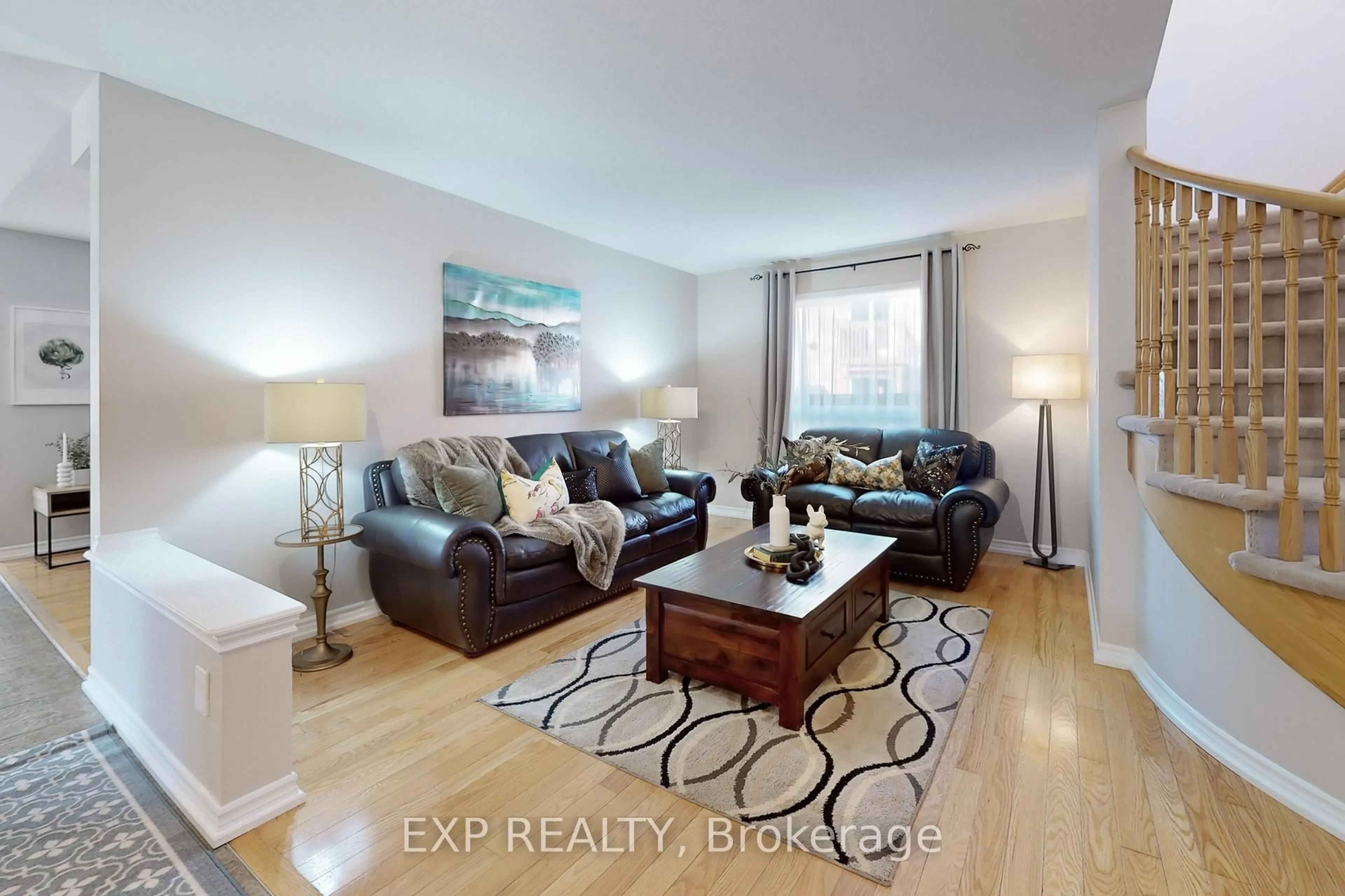 Living room with furniture, wood/laminate floor for 1511 Ceresino Cres, Innisfil Ontario L9S 0B8