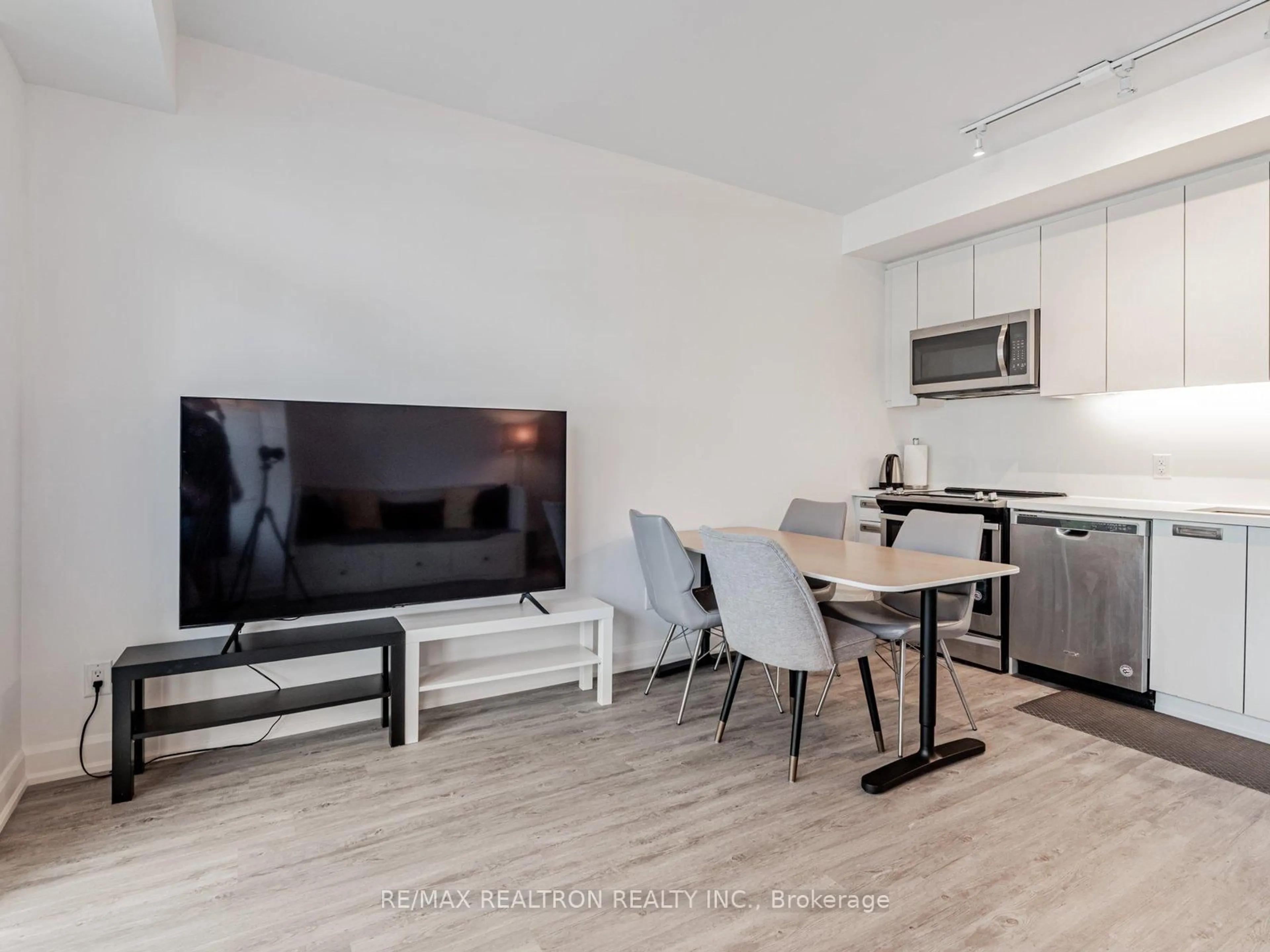 Living room with furniture, wood/laminate floor for 333 Sea Ray Ave #D113, Innisfil Ontario L9S 0M3