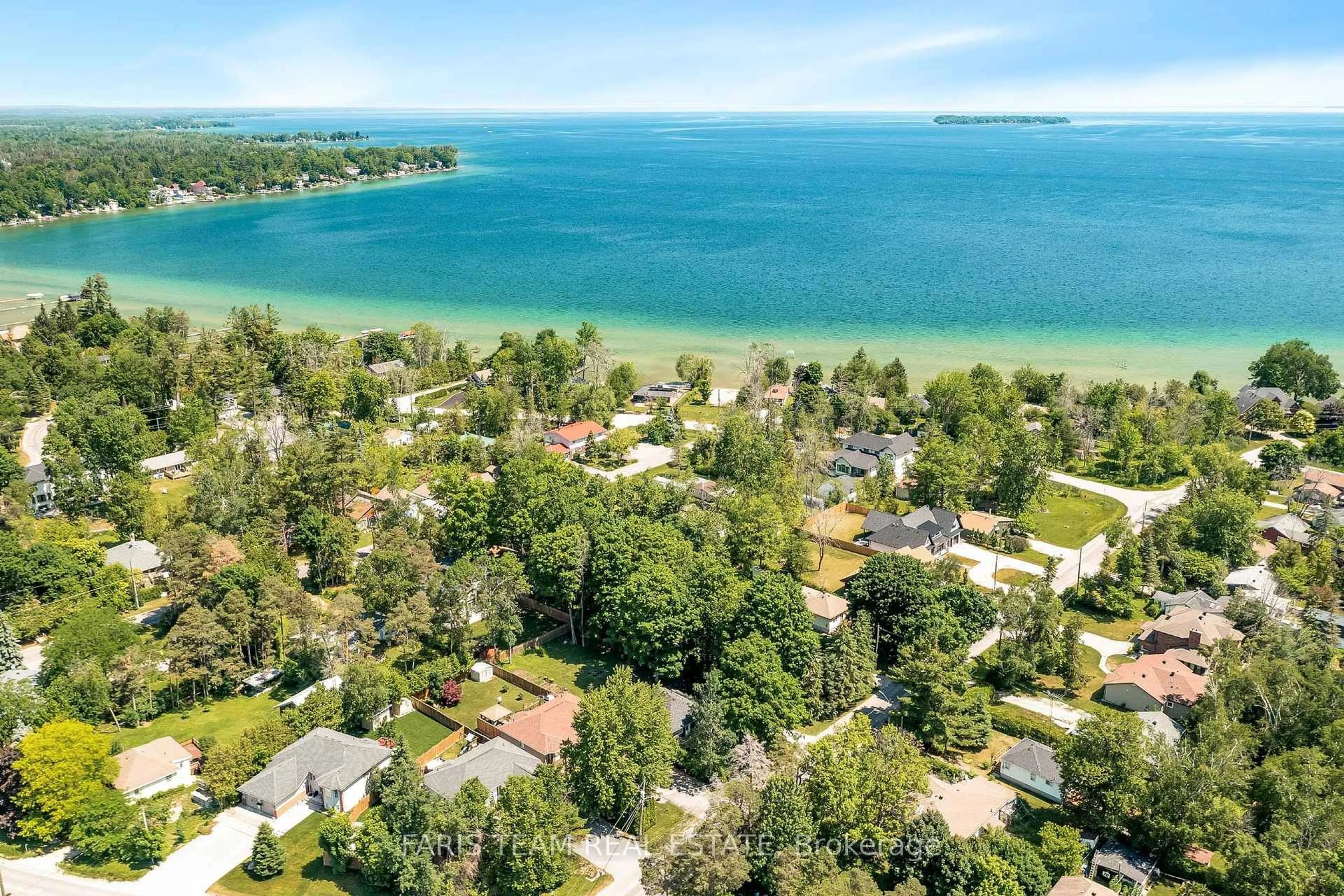 A pic from outside/outdoor area/front of a property/back of a property/a pic from drone, water/lake/river/ocean view for 882 Kennedy Rd, Innisfil Ontario L9S 4M5