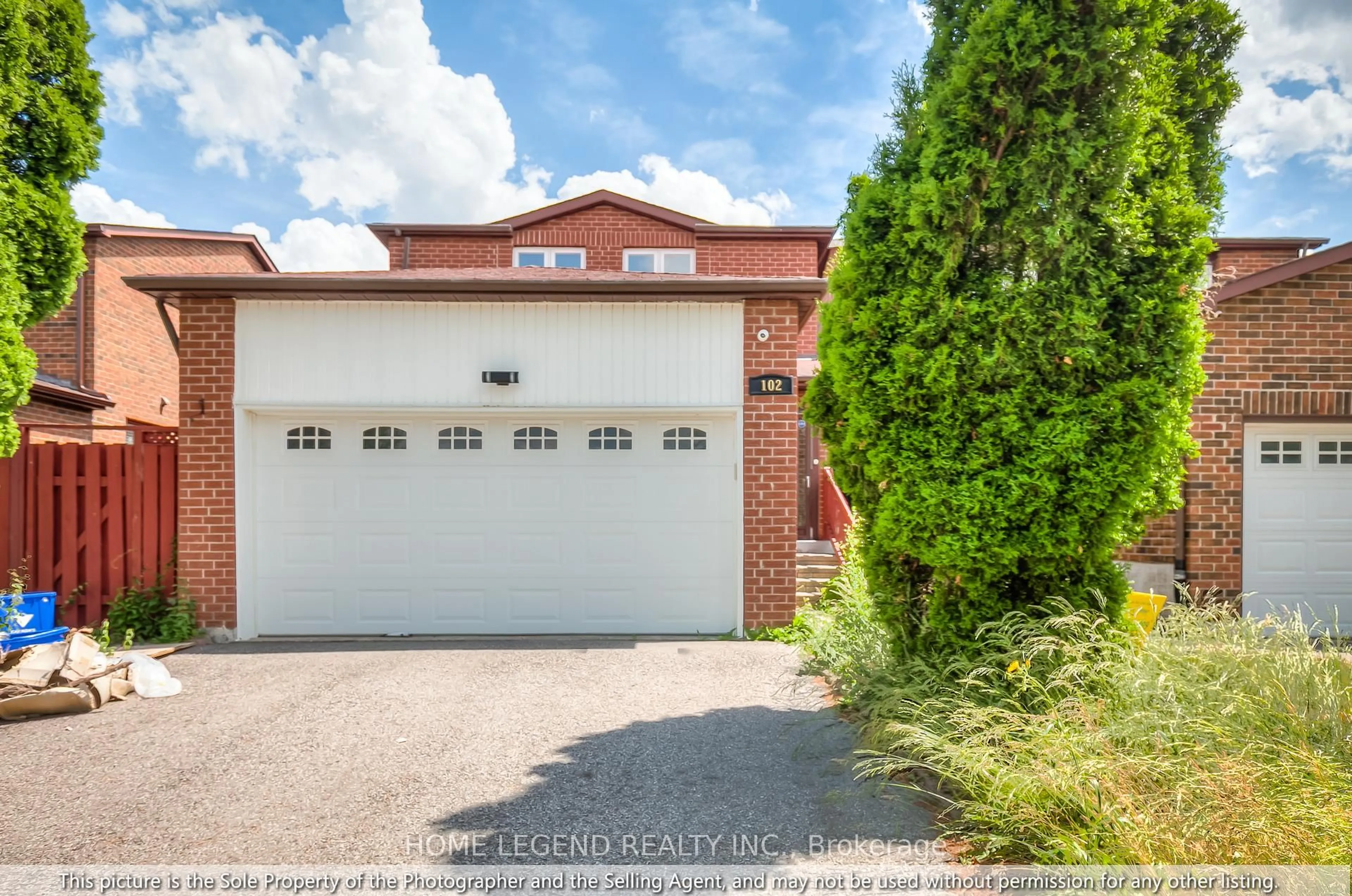Home with brick exterior material, street for 102 Tangmere Cres, Markham Ontario L3R 6Y5