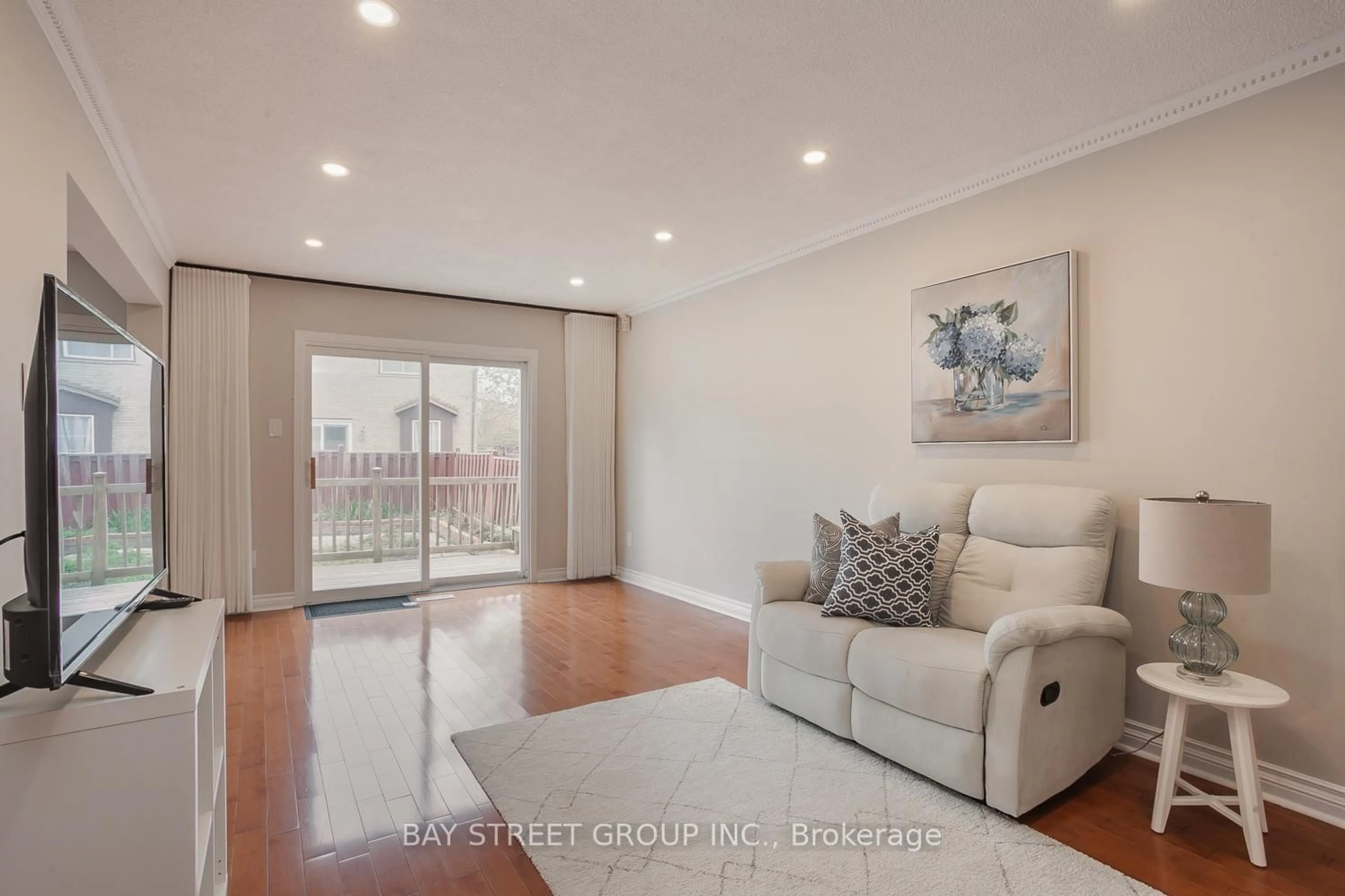 Living room with furniture, wood/laminate floor for 3 Upton Cres, Markham Ontario L3R 3T3