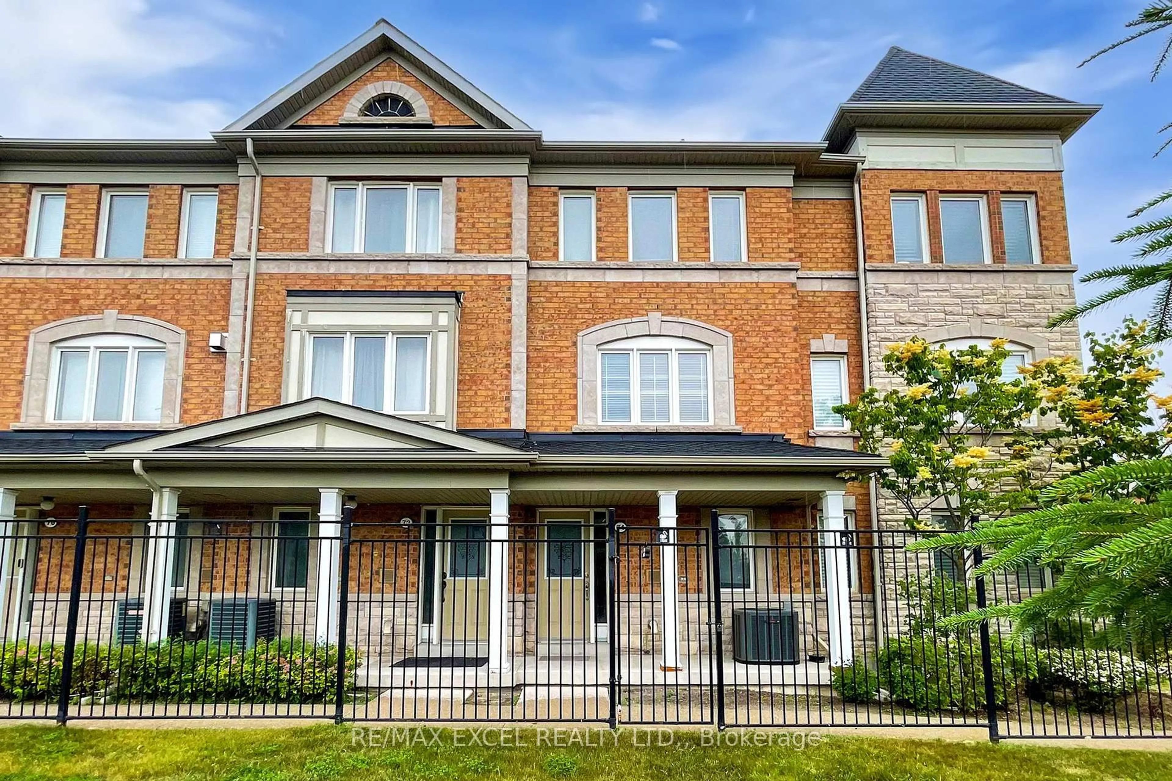 Home with brick exterior material, street for 74 Sanctuary Way, Markham Ontario L6E 0C2