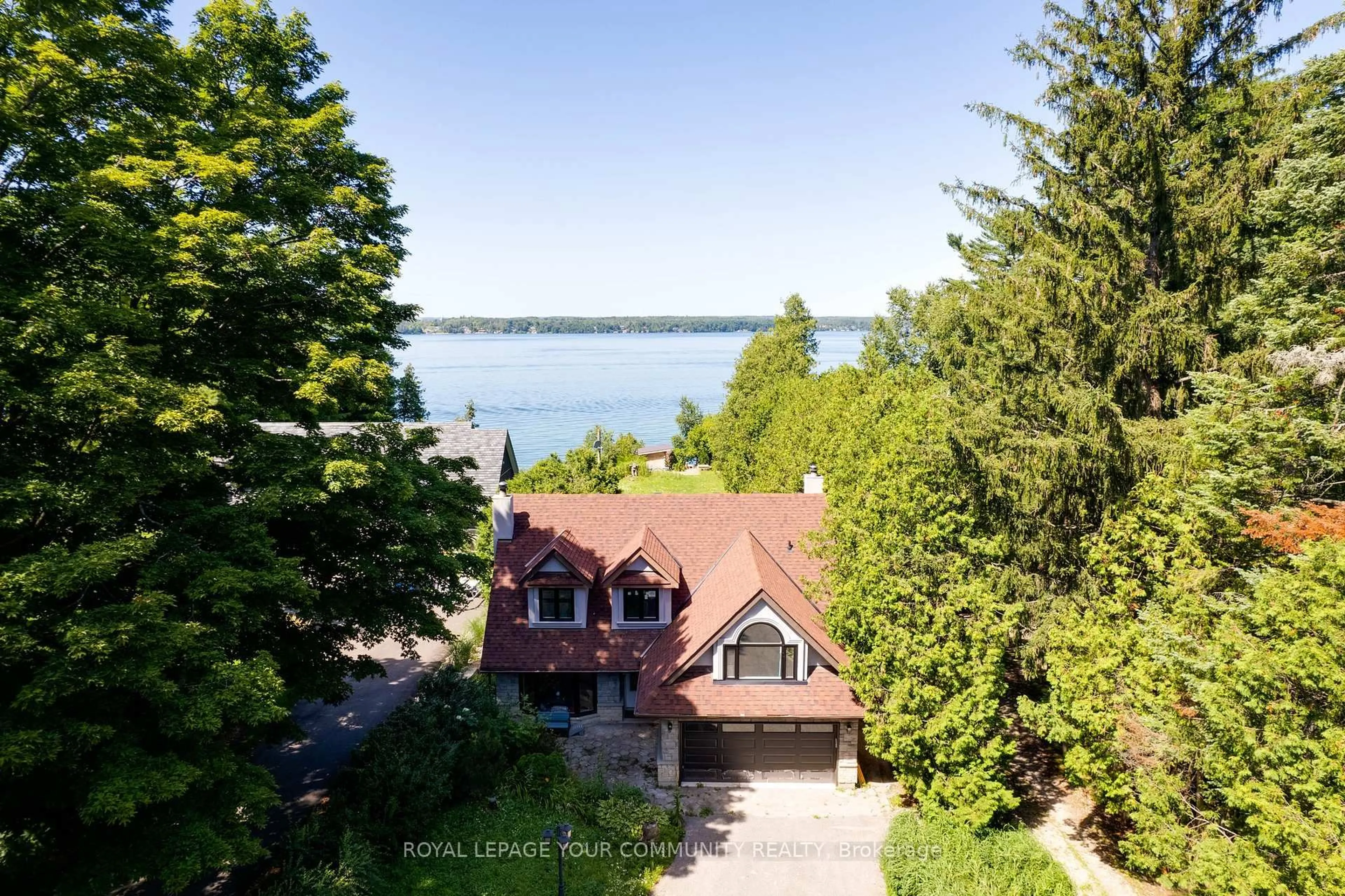 A pic from outside/outdoor area/front of a property/back of a property/a pic from drone, water/lake/river/ocean view for 3994 Guest Rd, Innisfil Ontario L9S 2T4