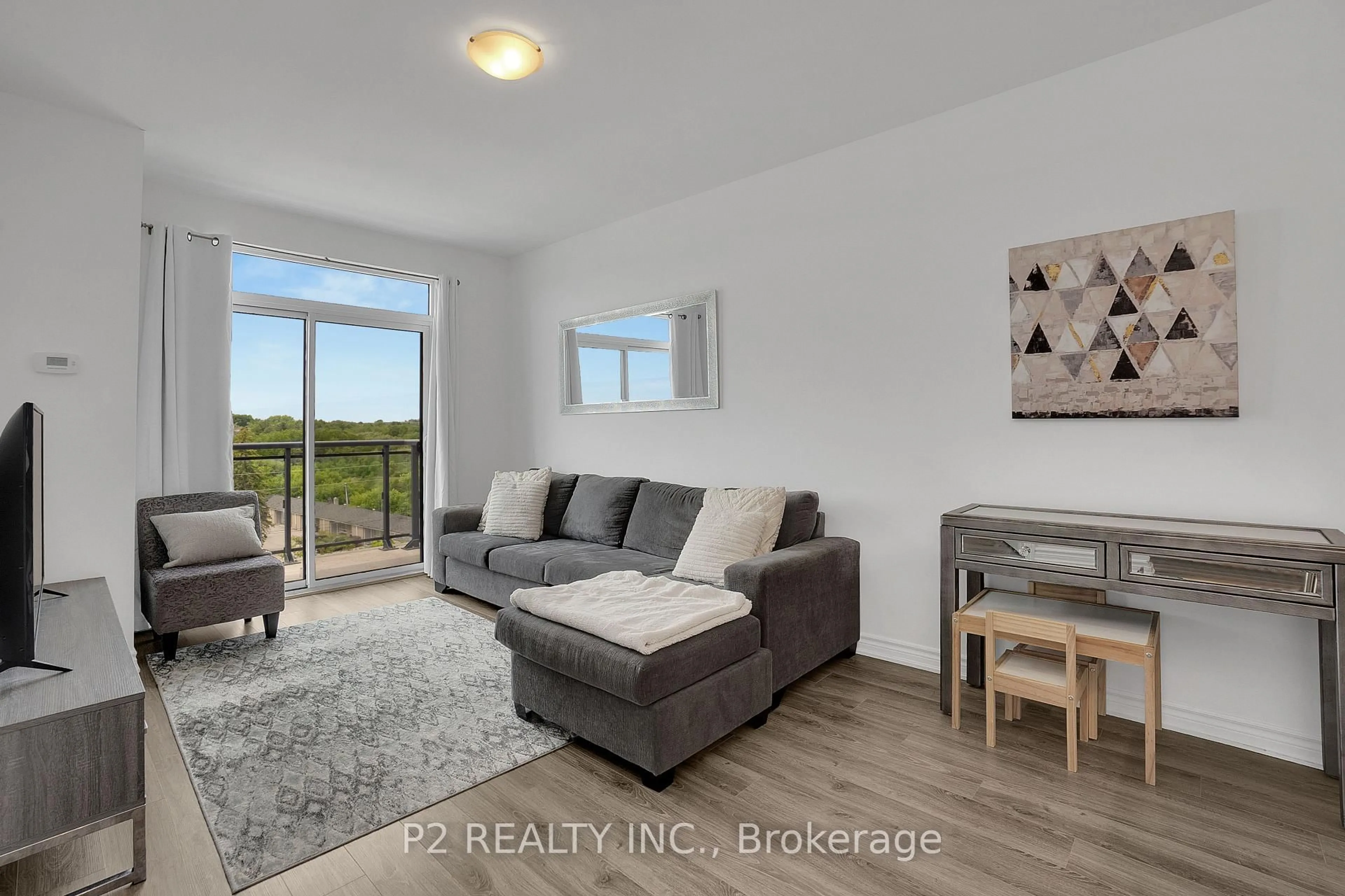 Living room with furniture, wood/laminate floor for 11611 Yonge St #716, Richmond Hill Ontario L4E 1G2