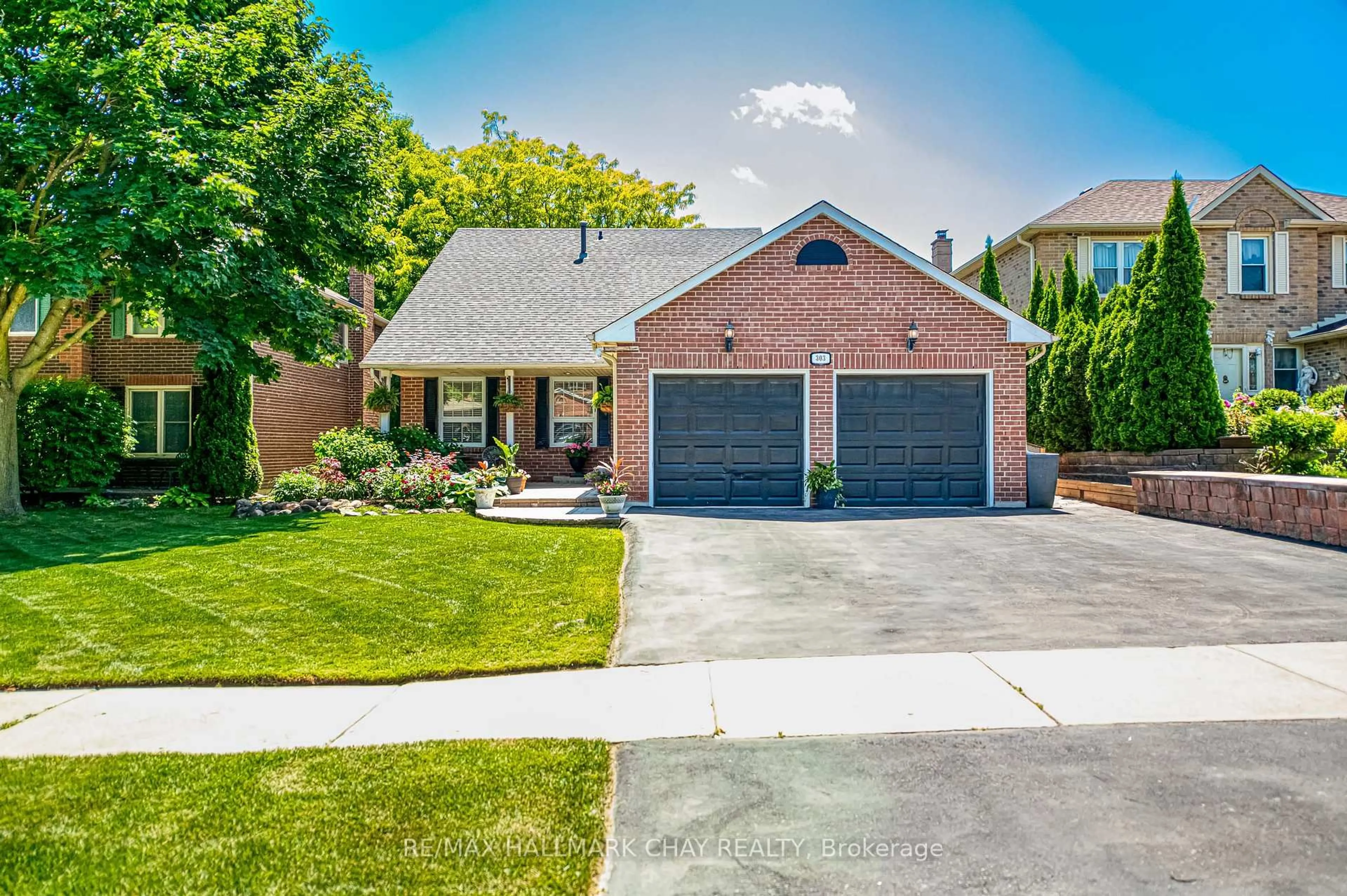 Home with brick exterior material, street for 303 John Bowser Cres, Newmarket Ontario L3Y 7N9