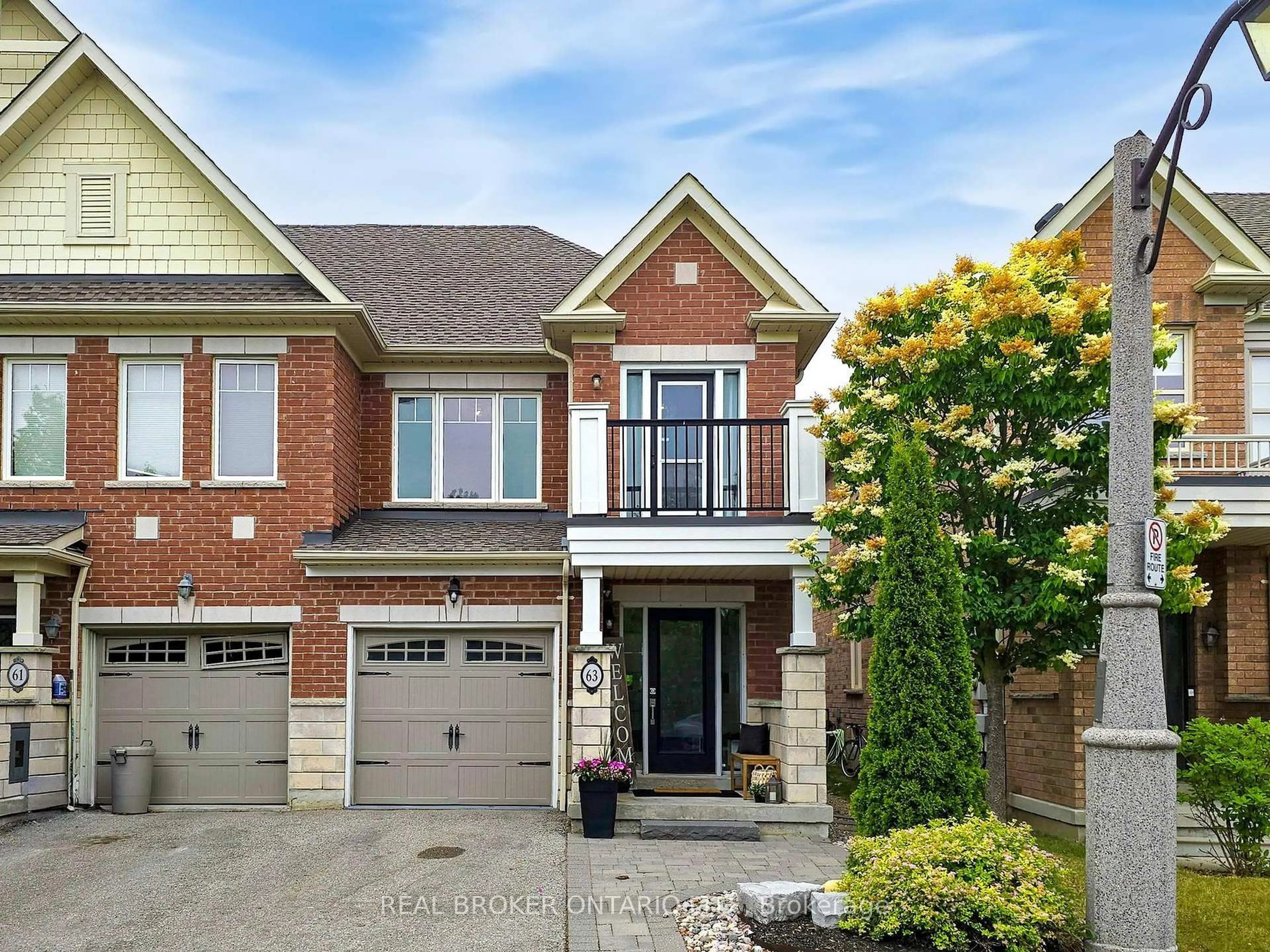 Home with brick exterior material, street for 63 Northwest Passage, Whitchurch-Stouffville Ontario L4A 0T2
