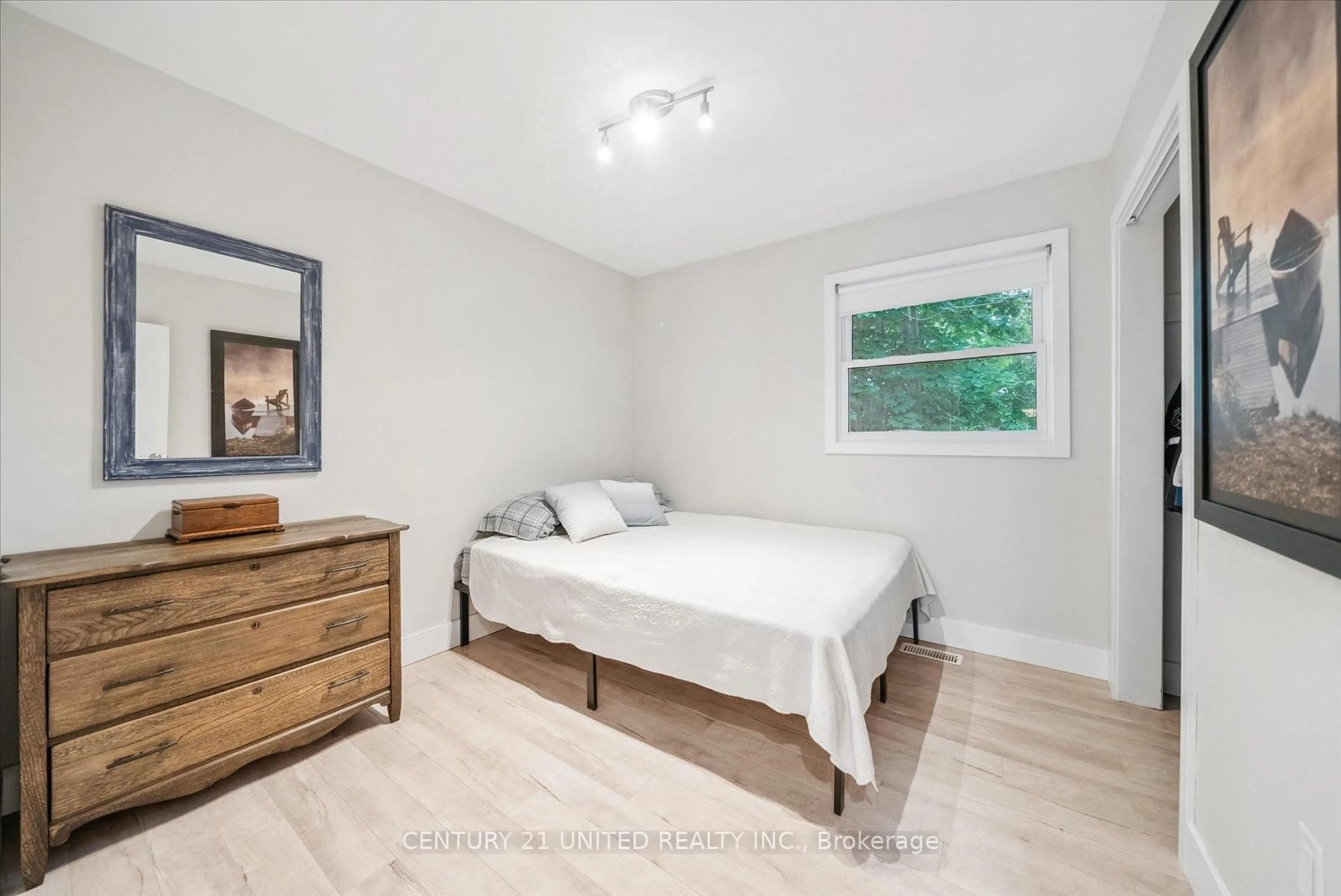 Bedroom with bed, wood/laminate floor for 5 Church St, Brock Ontario L0C 1H0