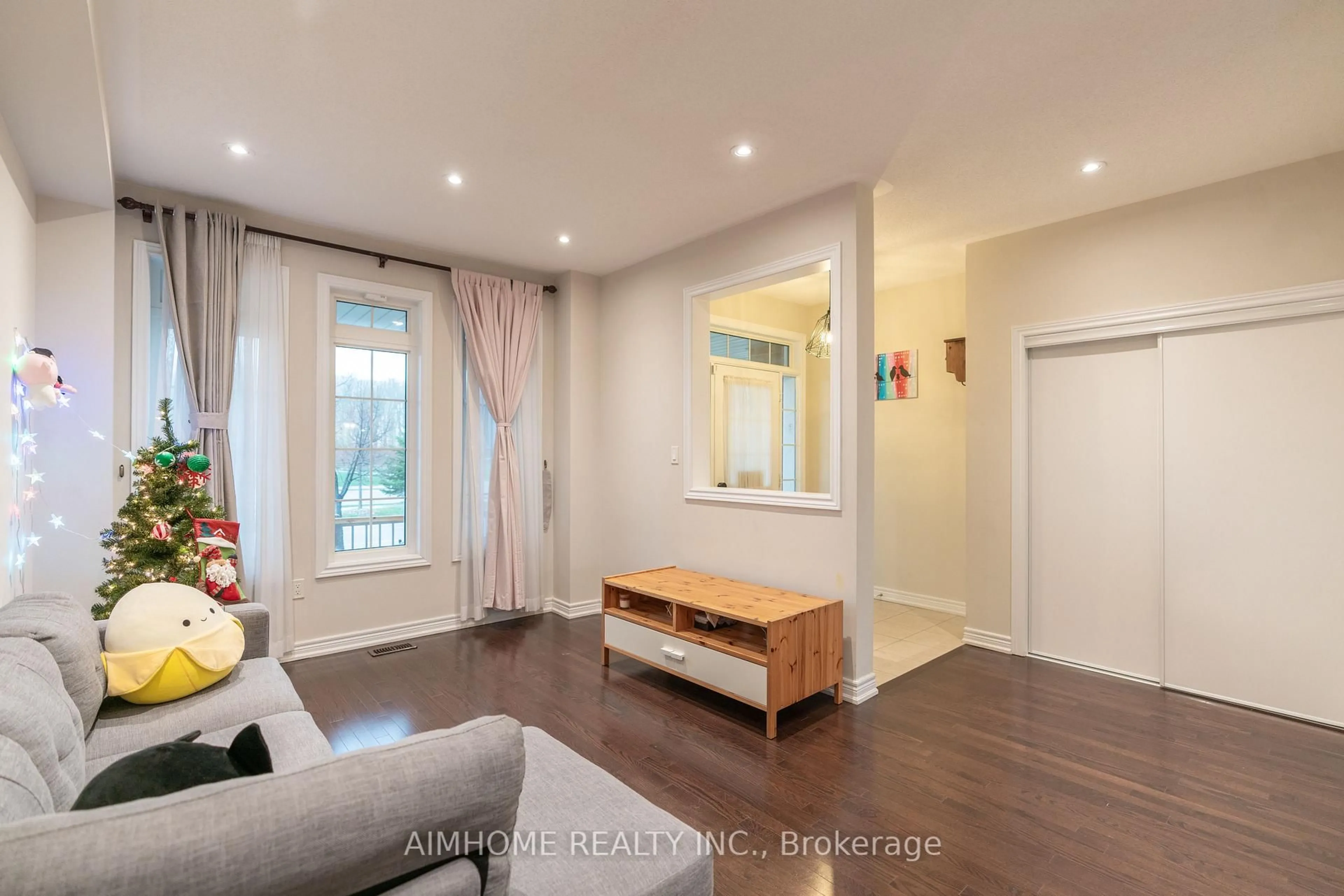 Living room with furniture, wood/laminate floor for 934 Castlemore Ave, Markham Ontario L6E 0N3