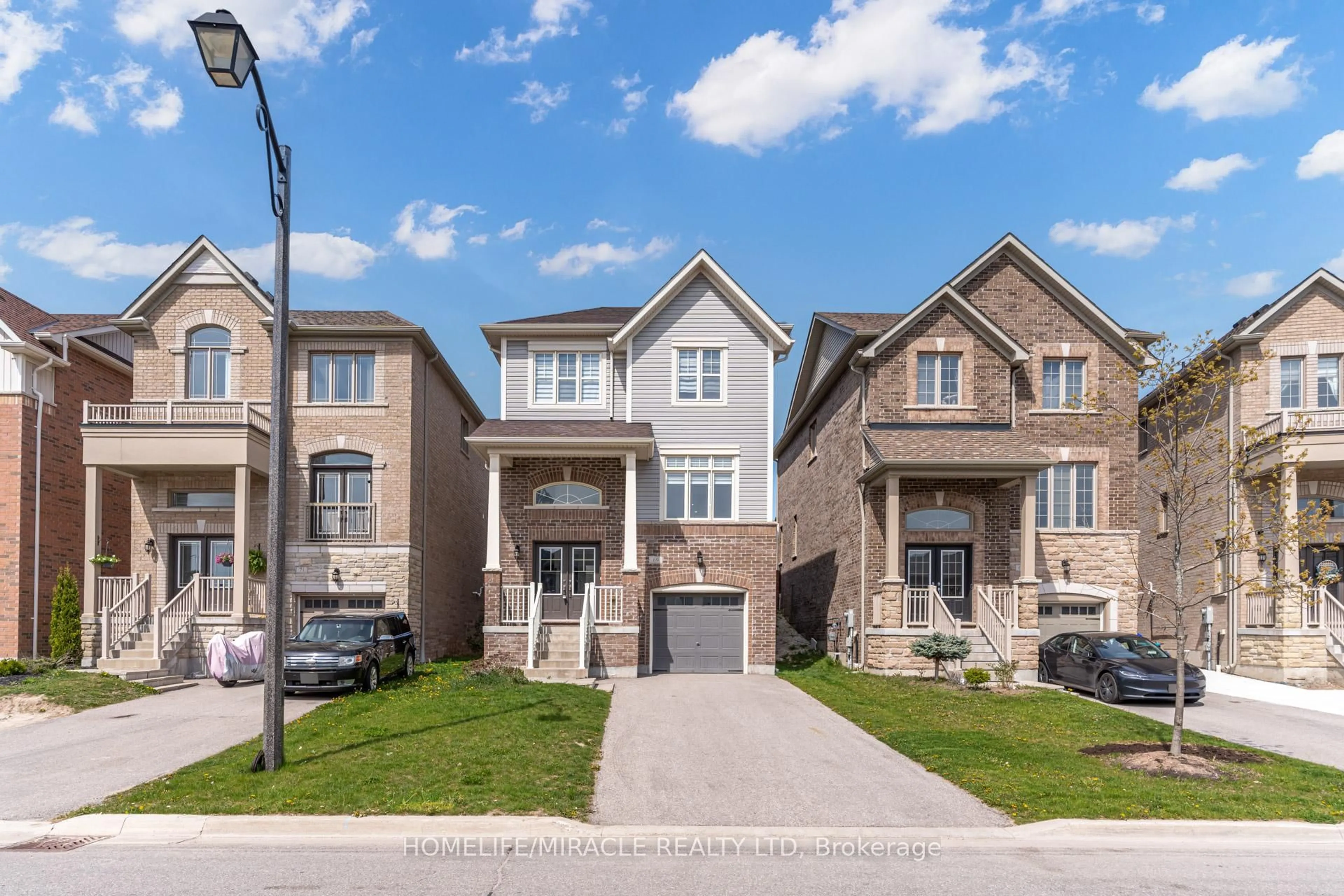 Home with brick exterior material, street for 69 Sutcliffe Way, New Tecumseth Ontario L9R 0N8