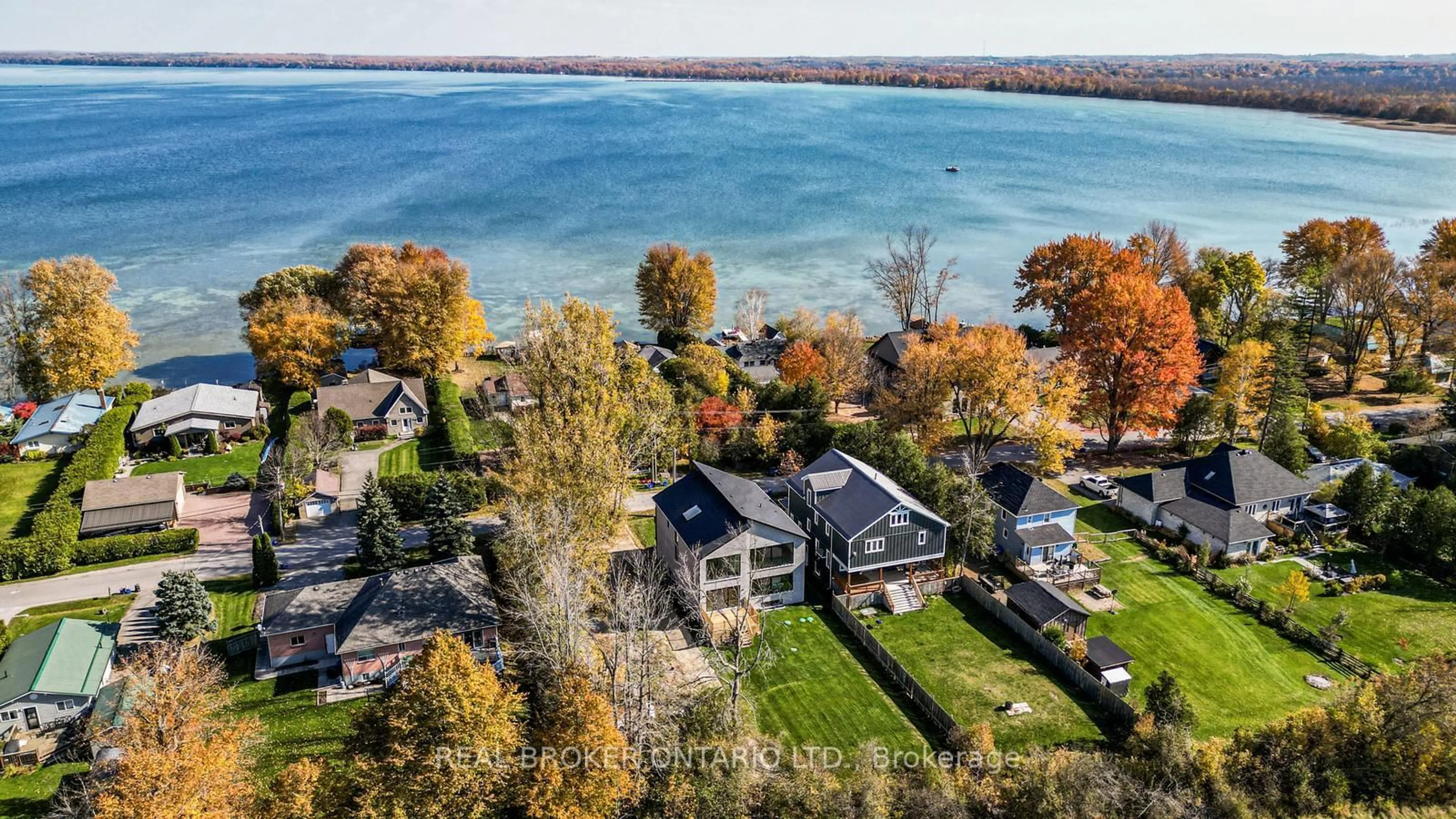 A pic from outside/outdoor area/front of a property/back of a property/a pic from drone, water/lake/river/ocean view for 496 Duclos Point Rd, Georgina Ontario L0E 1N0