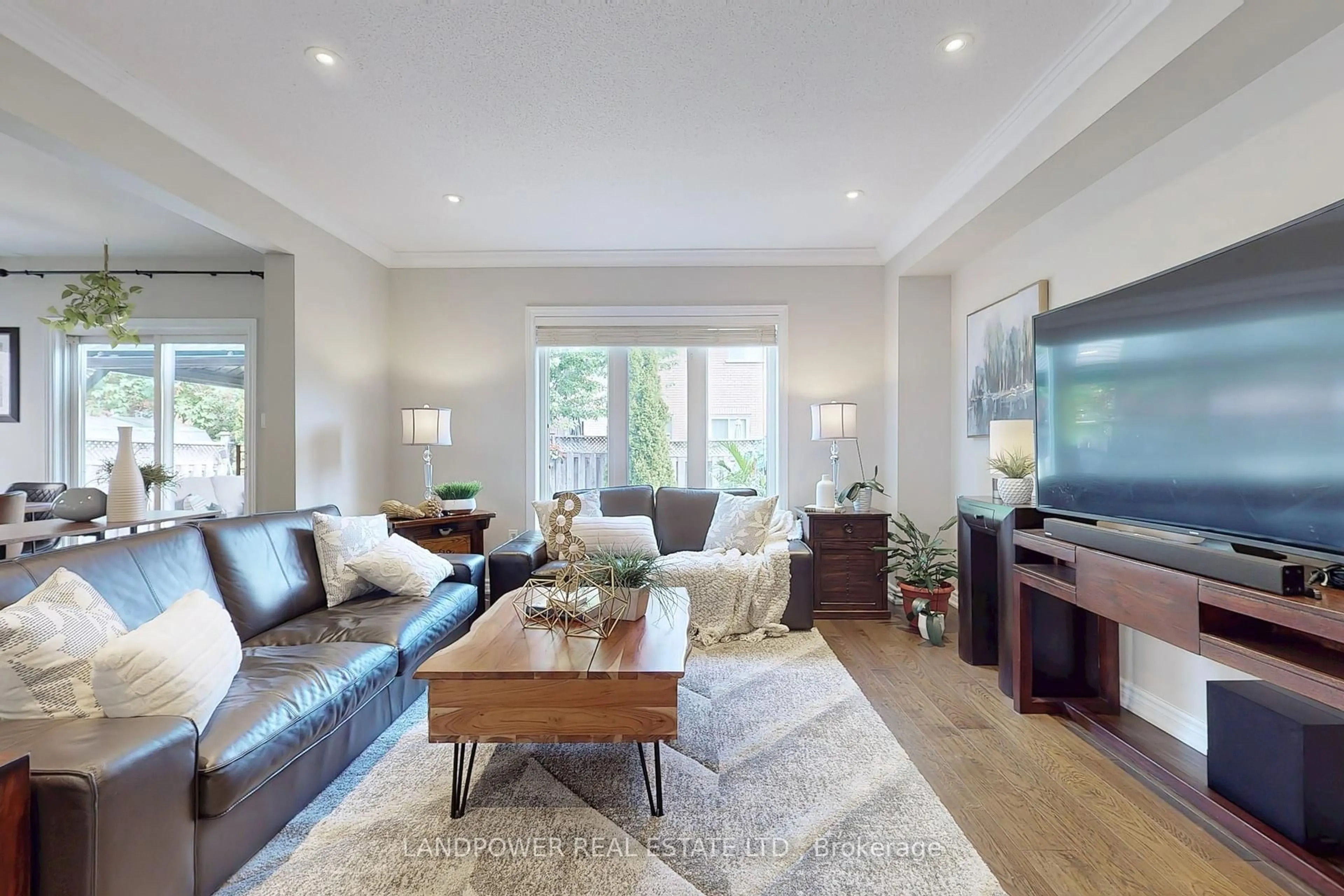 Living room with furniture, wood/laminate floor for 639 Society Cres, Newmarket Ontario L3X 2V8