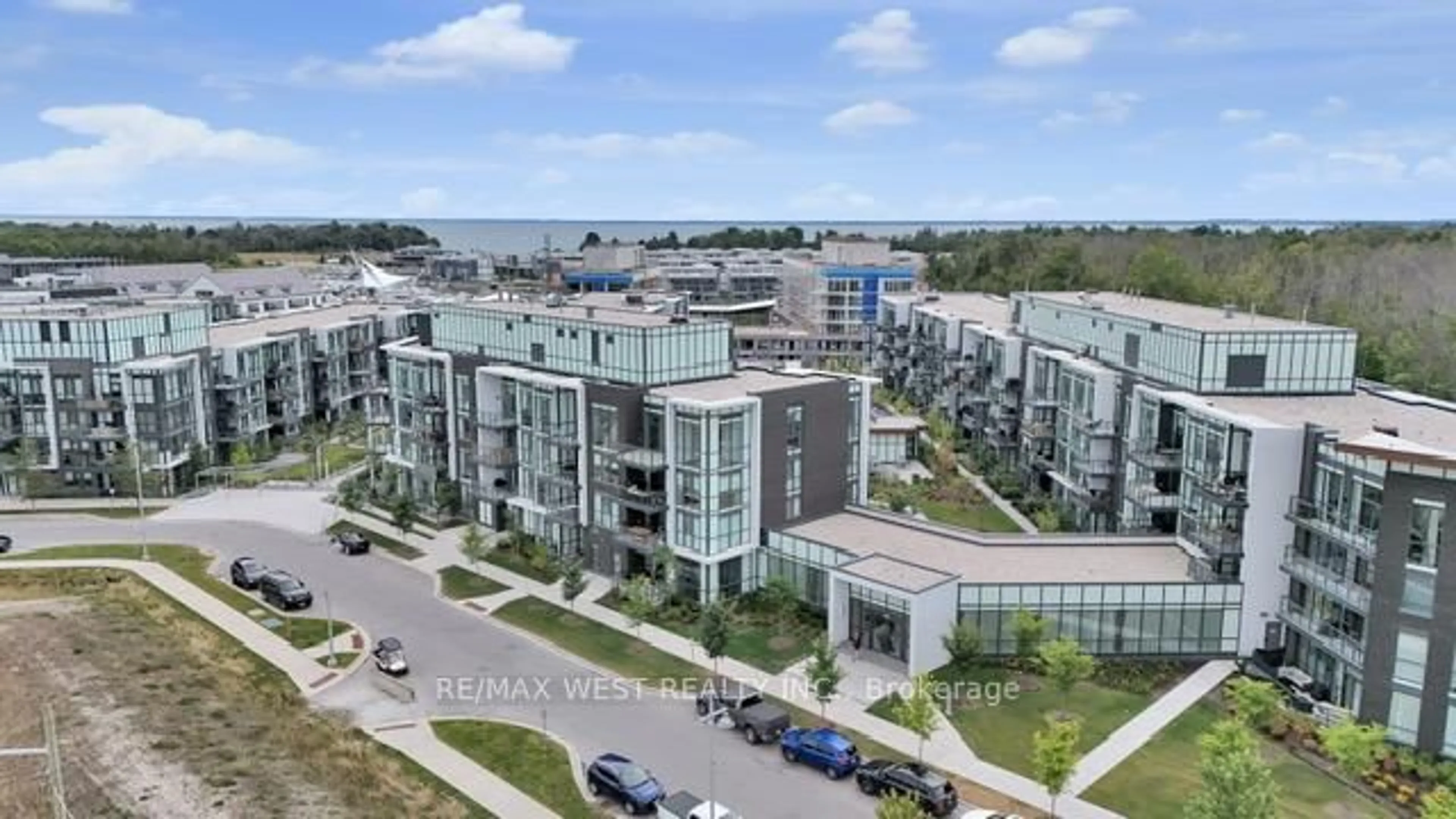 A pic from outside/outdoor area/front of a property/back of a property/a pic from drone, unknown for 415 Sea Ray Ave #114, Innisfil Ontario L9S 0R5