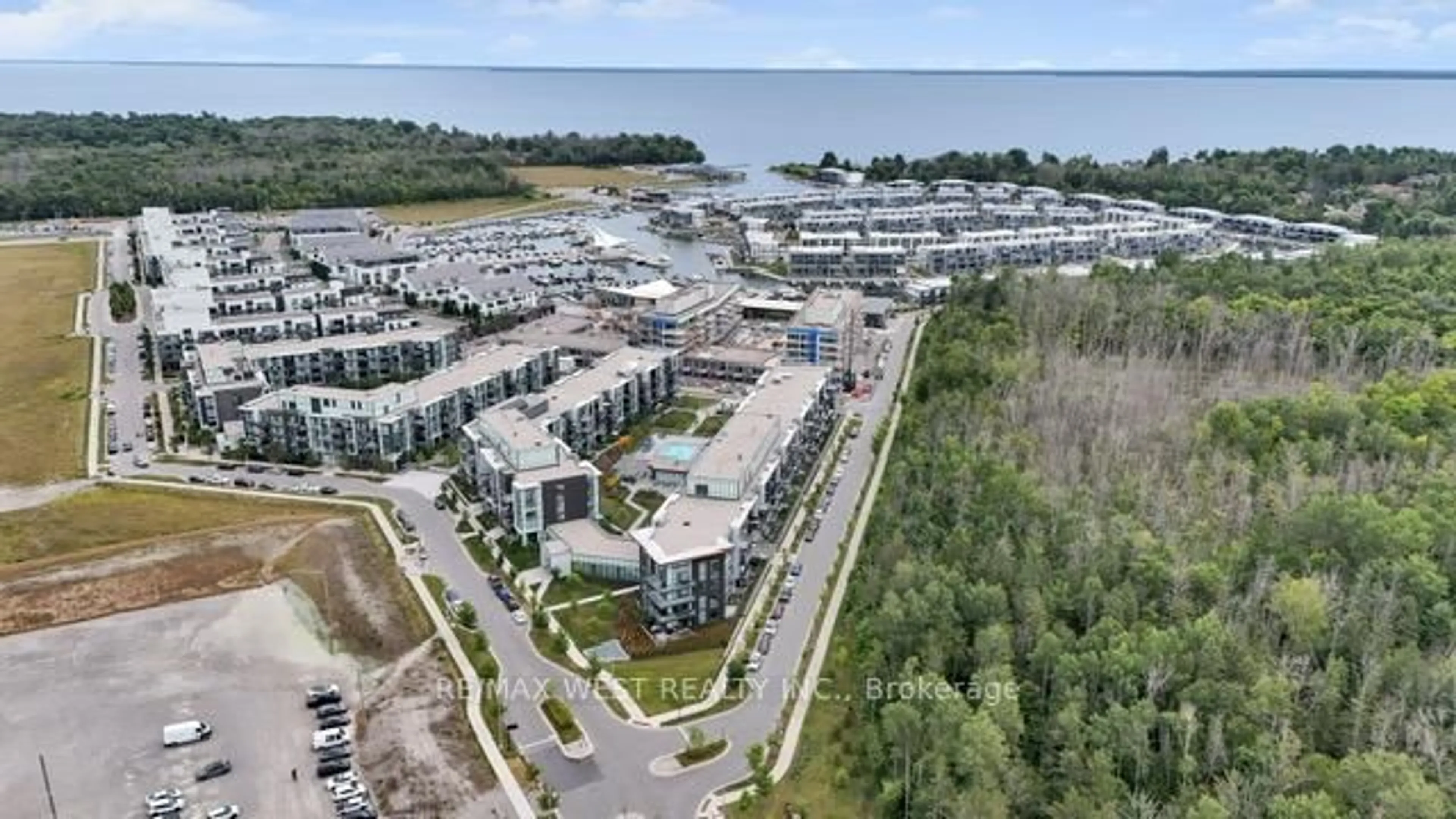 A pic from outside/outdoor area/front of a property/back of a property/a pic from drone, water/lake/river/ocean view for 415 Sea Ray Ave #114, Innisfil Ontario L9S 0R5