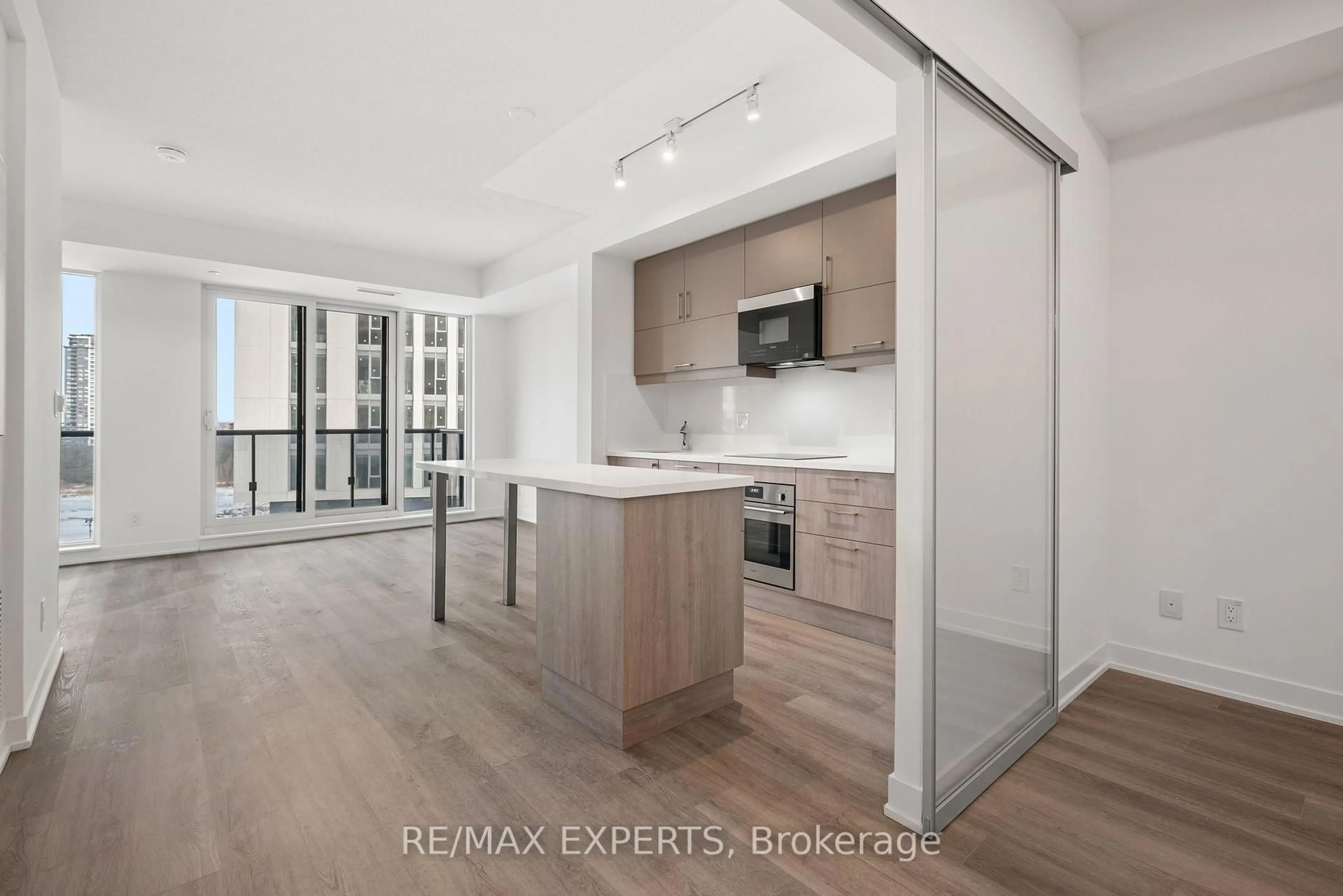 Open concept kitchen, wood/laminate floor for 8119 Birchmount Rd #828, Markham Ontario L6G 0H5