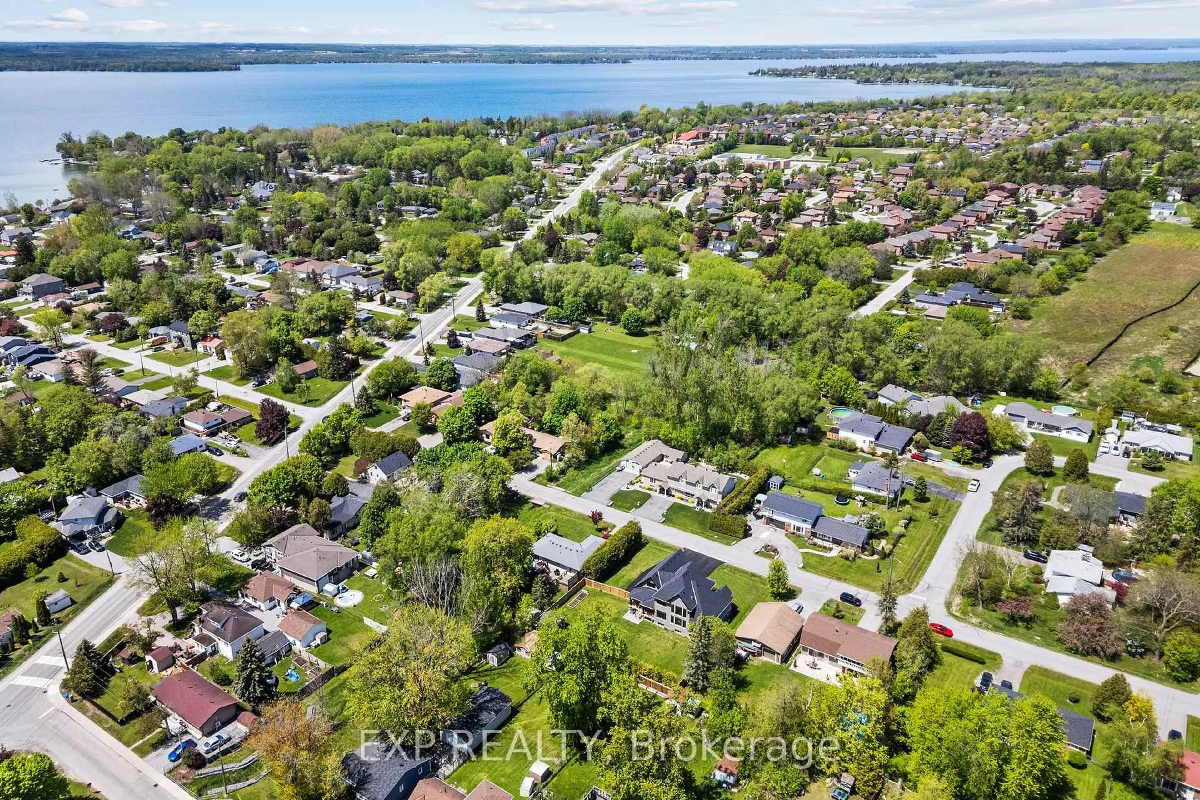 A pic from outside/outdoor area/front of a property/back of a property/a pic from drone, water/lake/river/ocean view for 227 Medina Dr, Georgina Ontario L4P 1G9