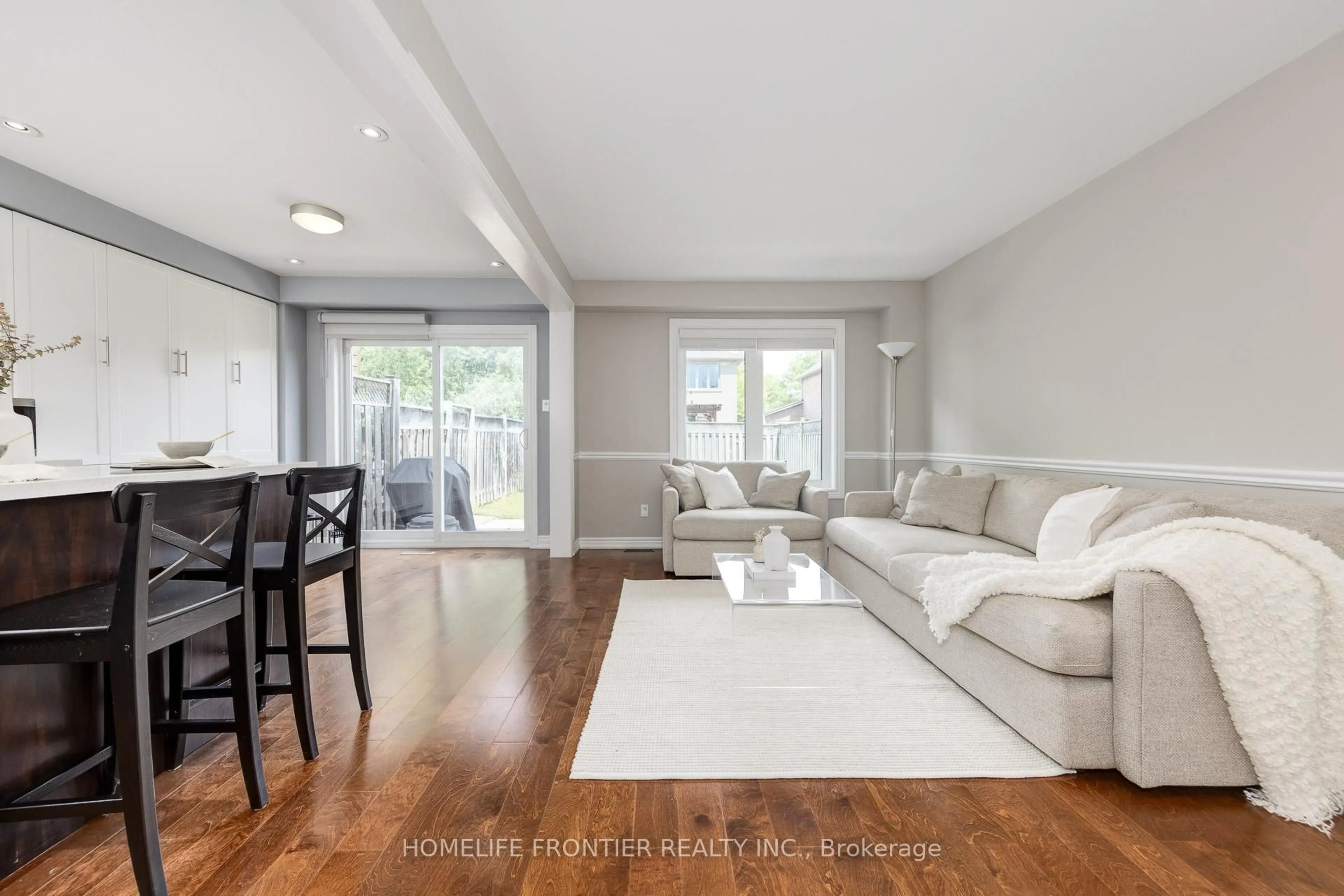 Living room with furniture, wood/laminate floor for 60 Carron Ave, Vaughan Ontario L6A 1Y6