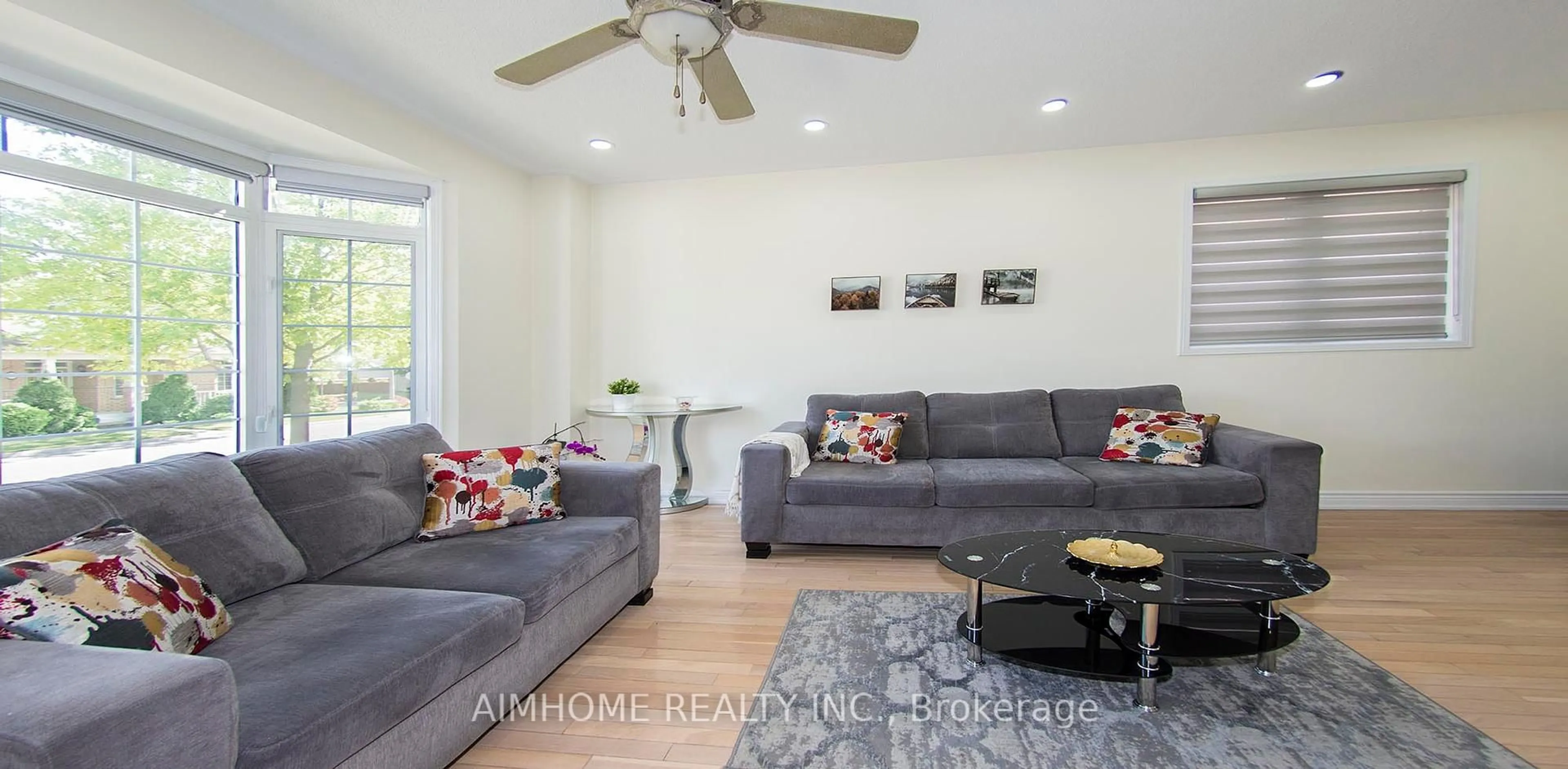 Living room with furniture, wood/laminate floor for 118 Emery Hill Blvd, Markham Ontario L6C 2S5