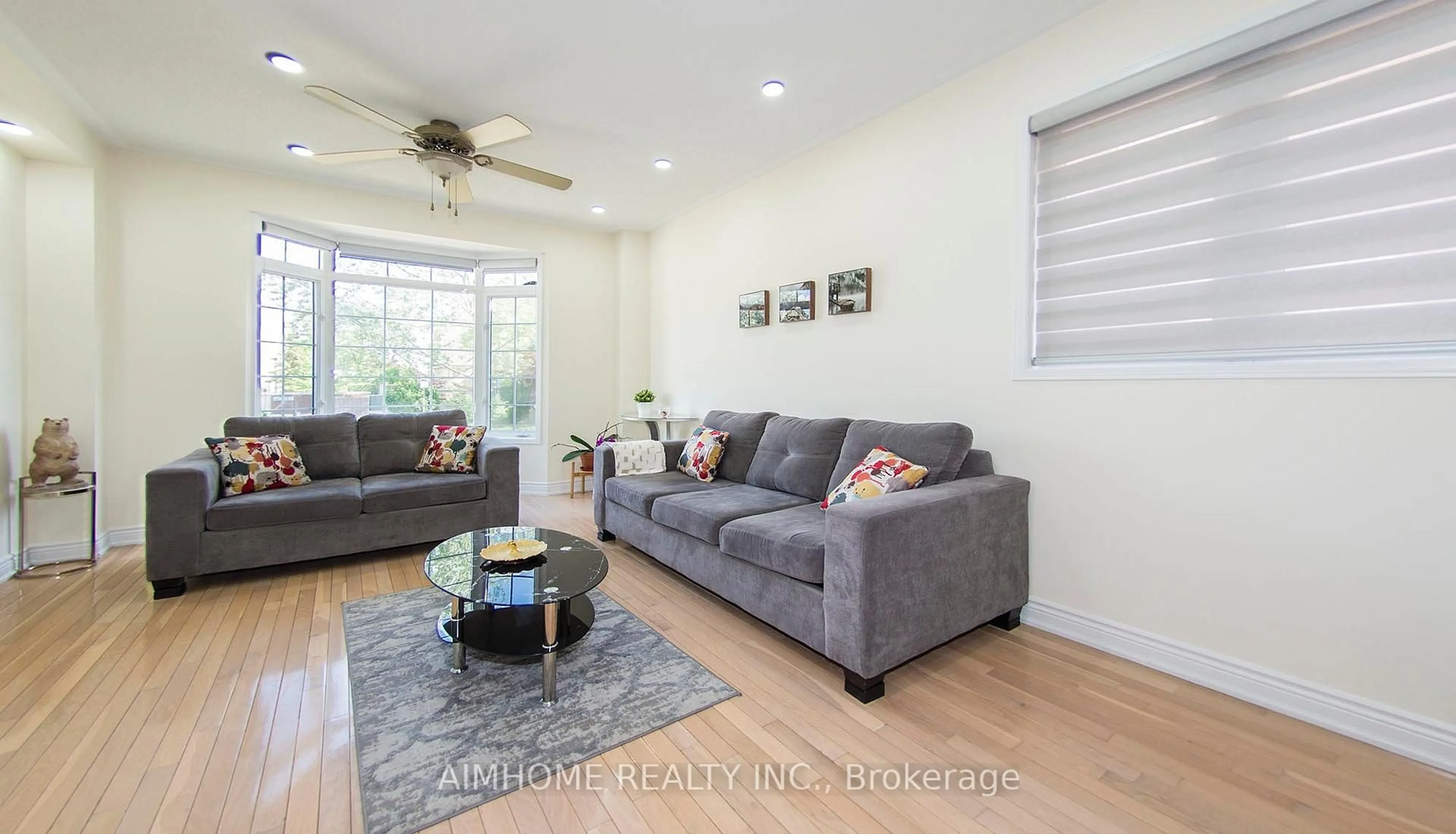 Living room with furniture, wood/laminate floor for 118 Emery Hill Blvd, Markham Ontario L6C 2S5