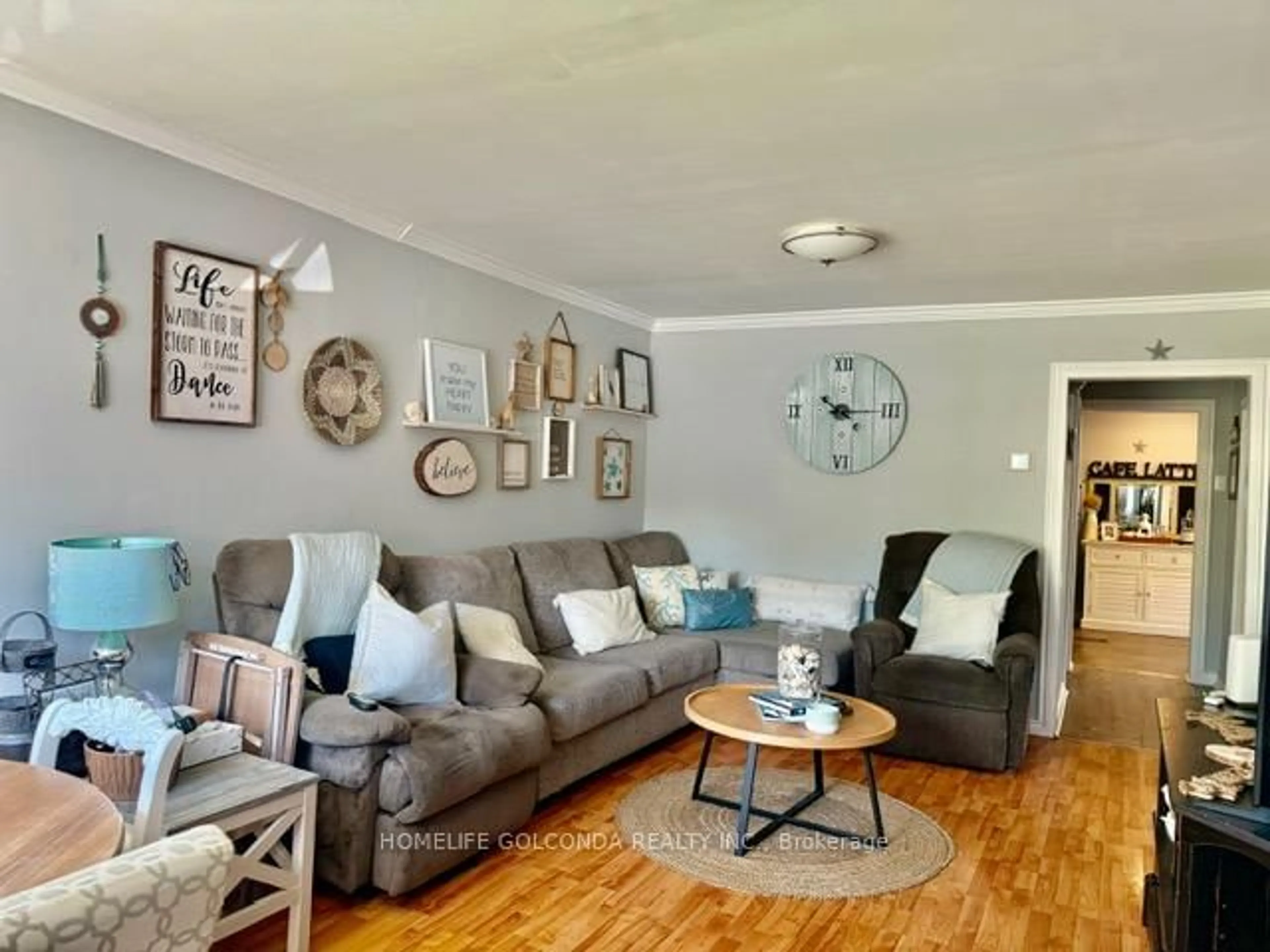 Living room with furniture, wood/laminate floor for 240 Pine Beach Dr, Georgina Ontario L4P 2B5