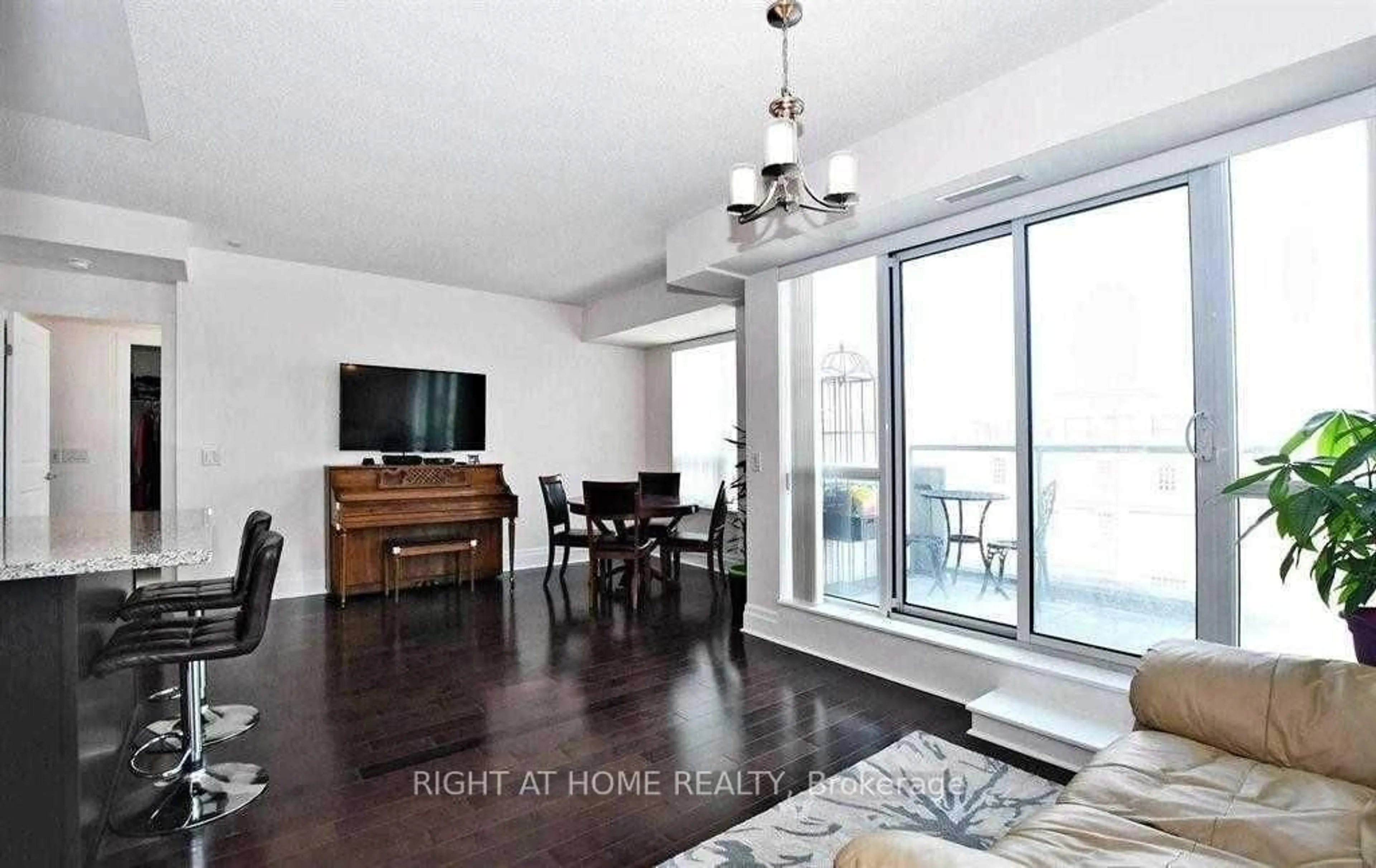 Living room with furniture, wood/laminate floor for 21 Upper Duke Cres #405, Markham Ontario L6G 0B7