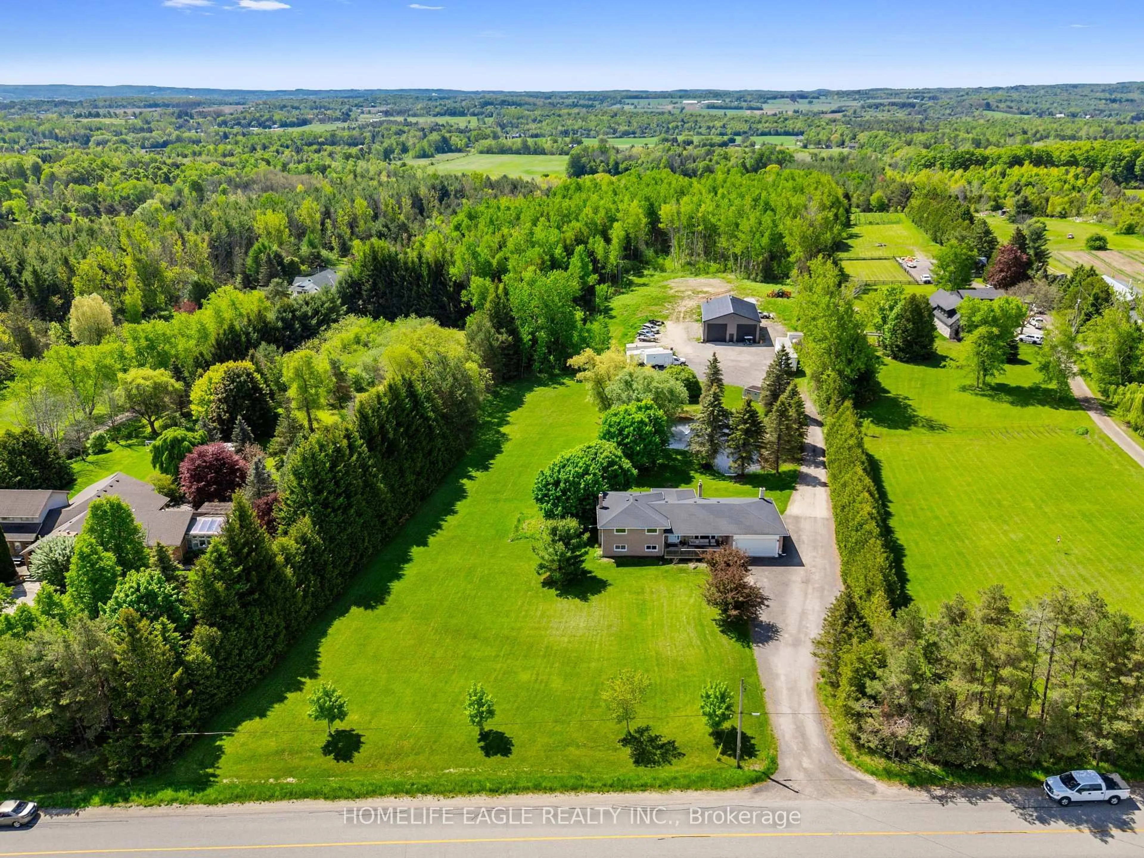 A pic from outside/outdoor area/front of a property/back of a property/a pic from drone, unknown for 5657 6th Line, New Tecumseth Ontario L0G 1W0