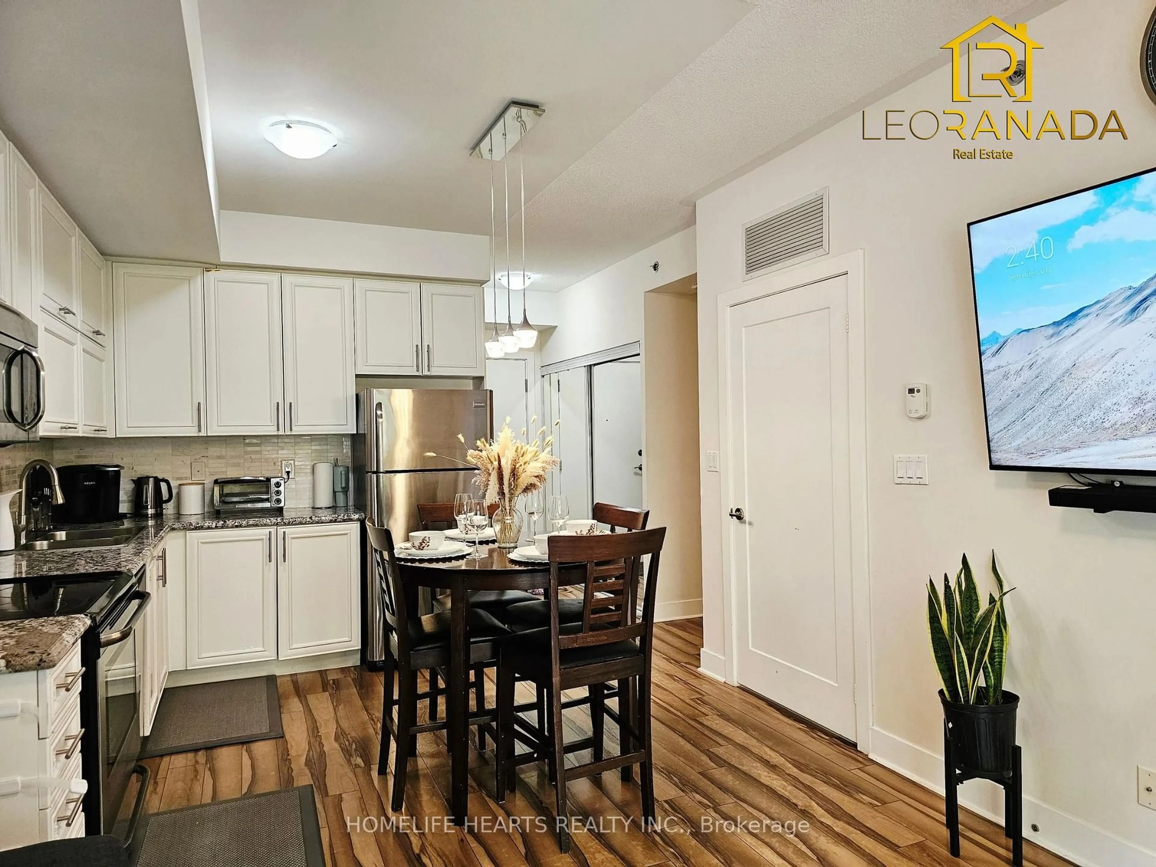Open concept kitchen, wood/laminate floor for 28 Prince Regent St #104, Markham Ontario L6C 0V5