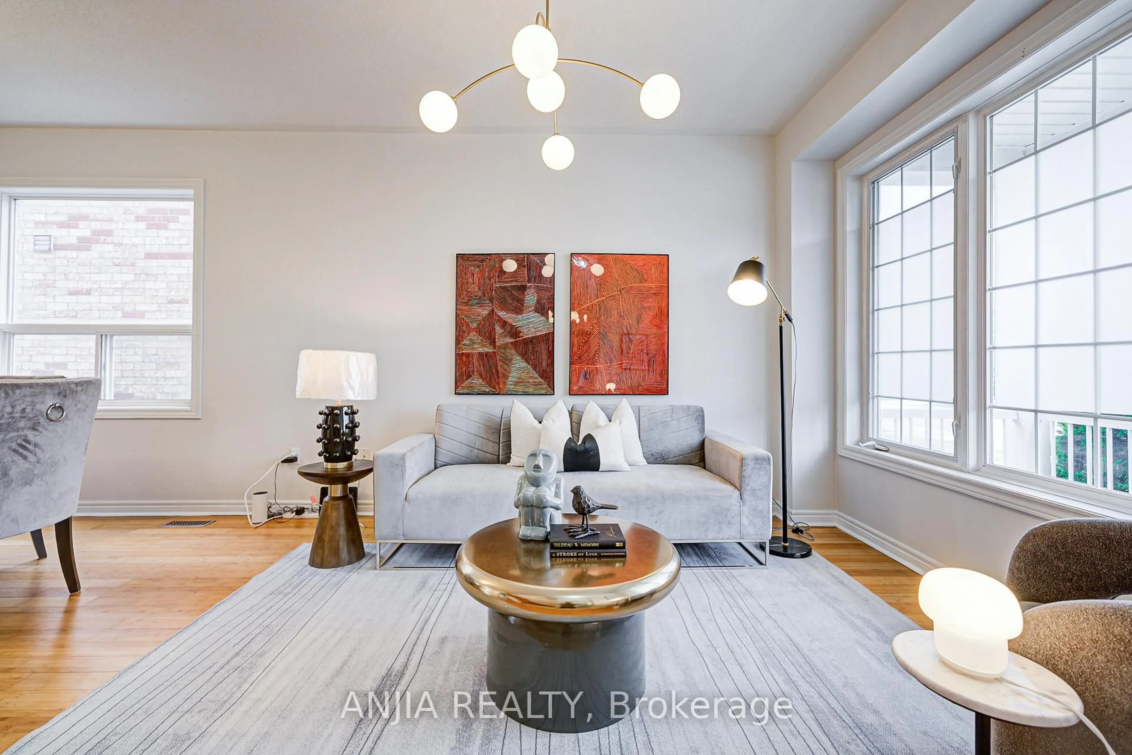 Living room with furniture, wood/laminate floor for 140 Edward Jefferys Ave, Markham Ontario L6E 1V5
