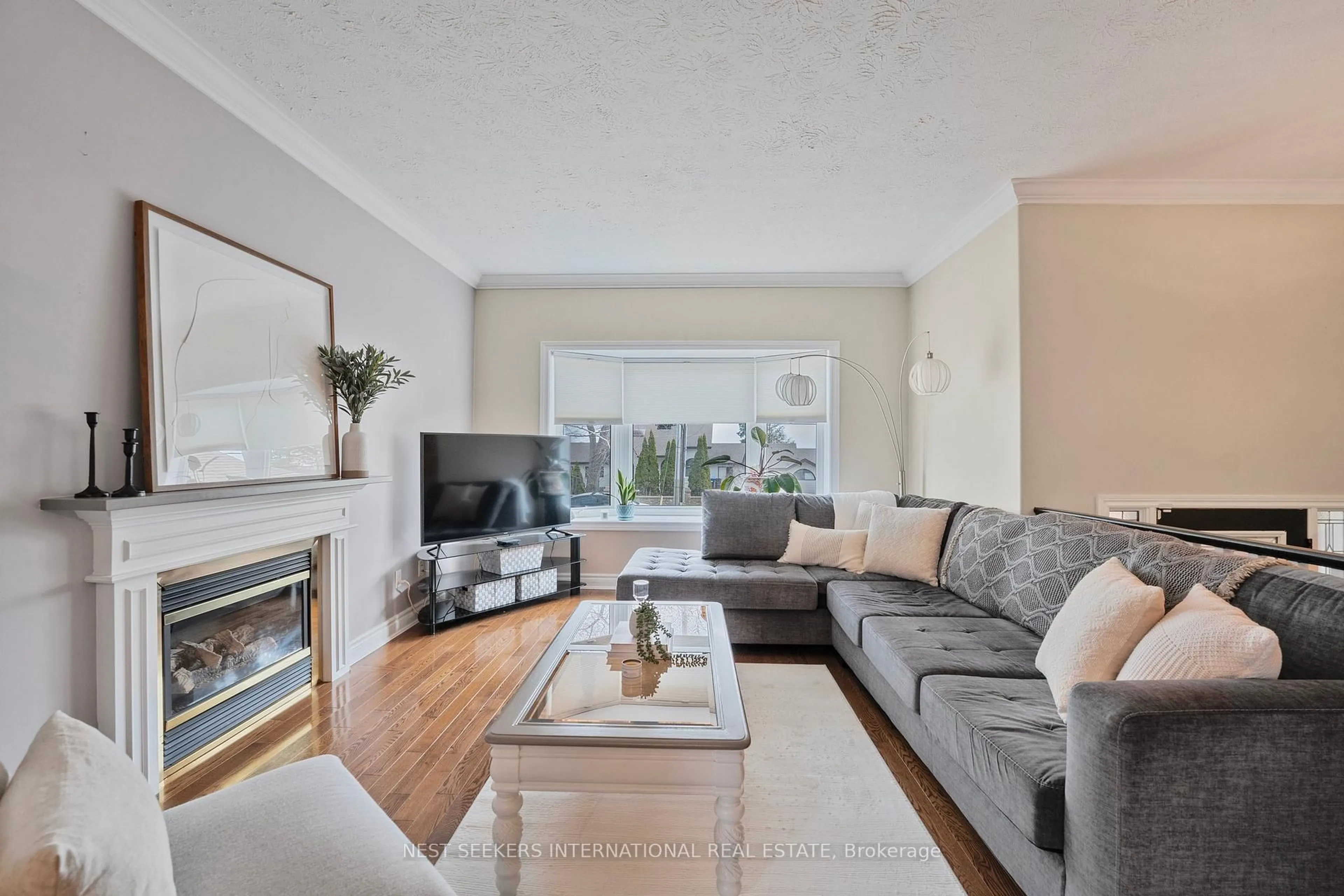 Living room with furniture, wood/laminate floor for 1438 Maple Rd, Innisfil Ontario L0L 1C0