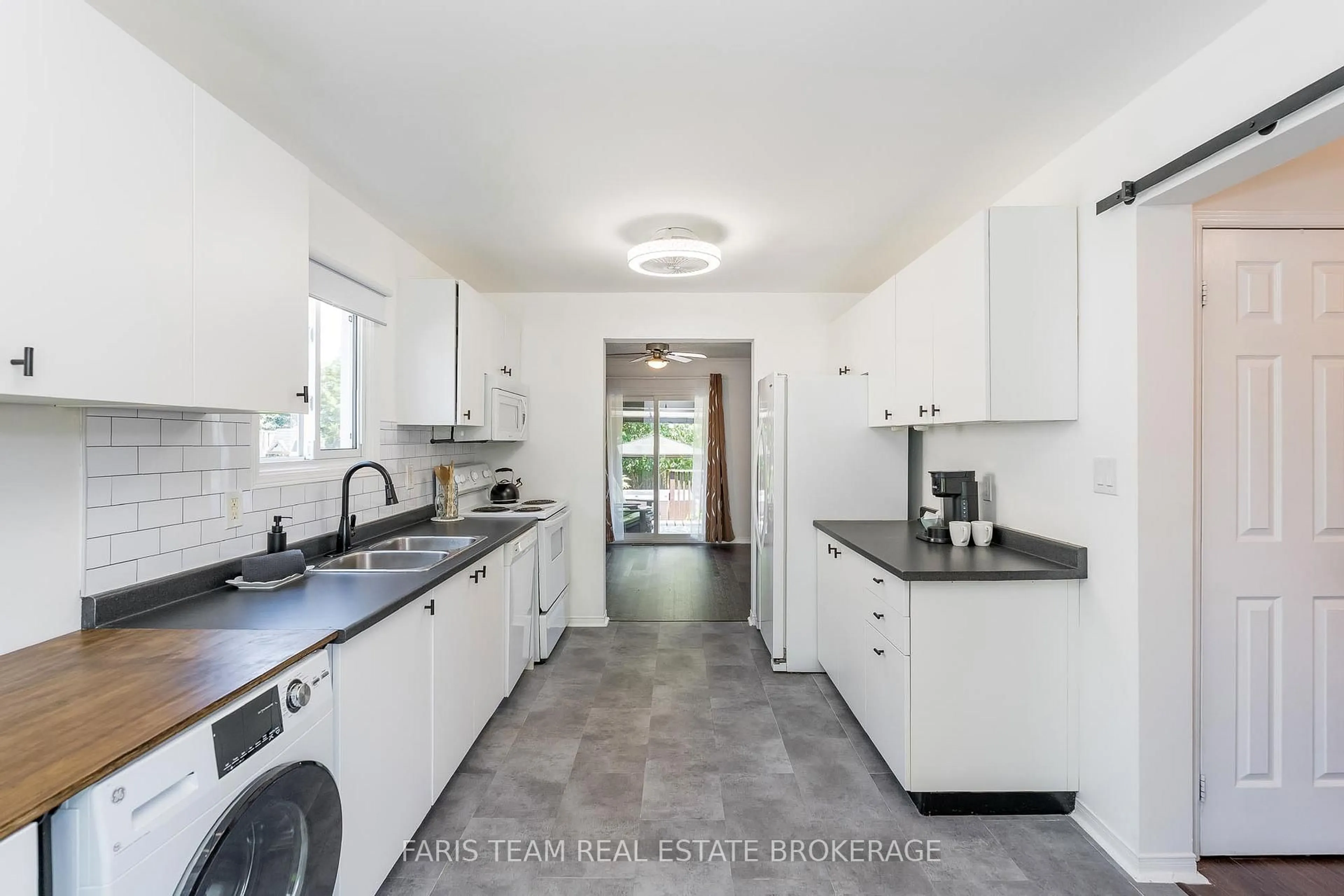 Kitchen with laundary machines, ceramic/tile floor for 717 Candaras St, Innisfil Ontario L9S 2G9
