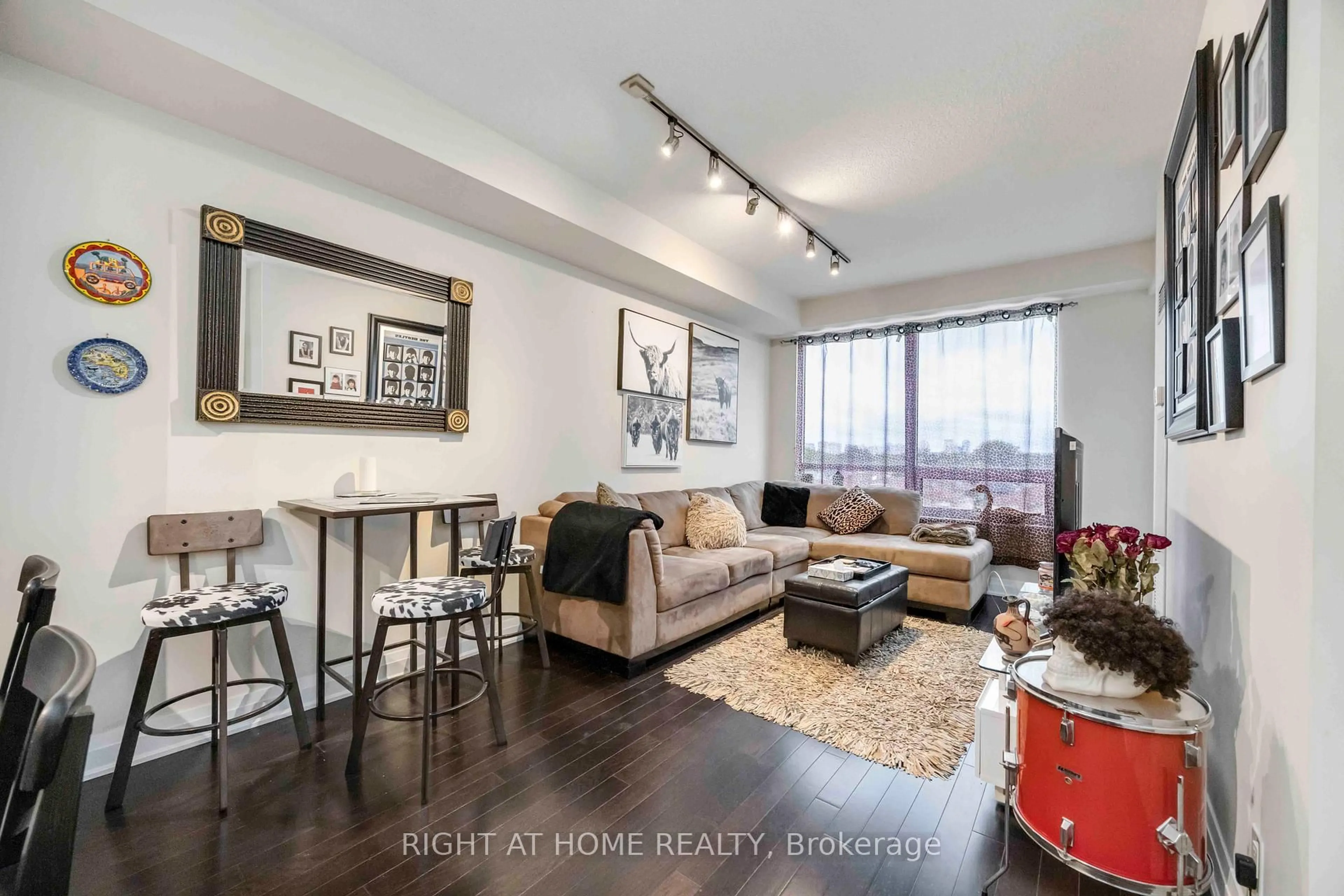 Living room with furniture, wood/laminate floor for 520 Steeles Ave #703, Vaughan Ontario L4J 0H2