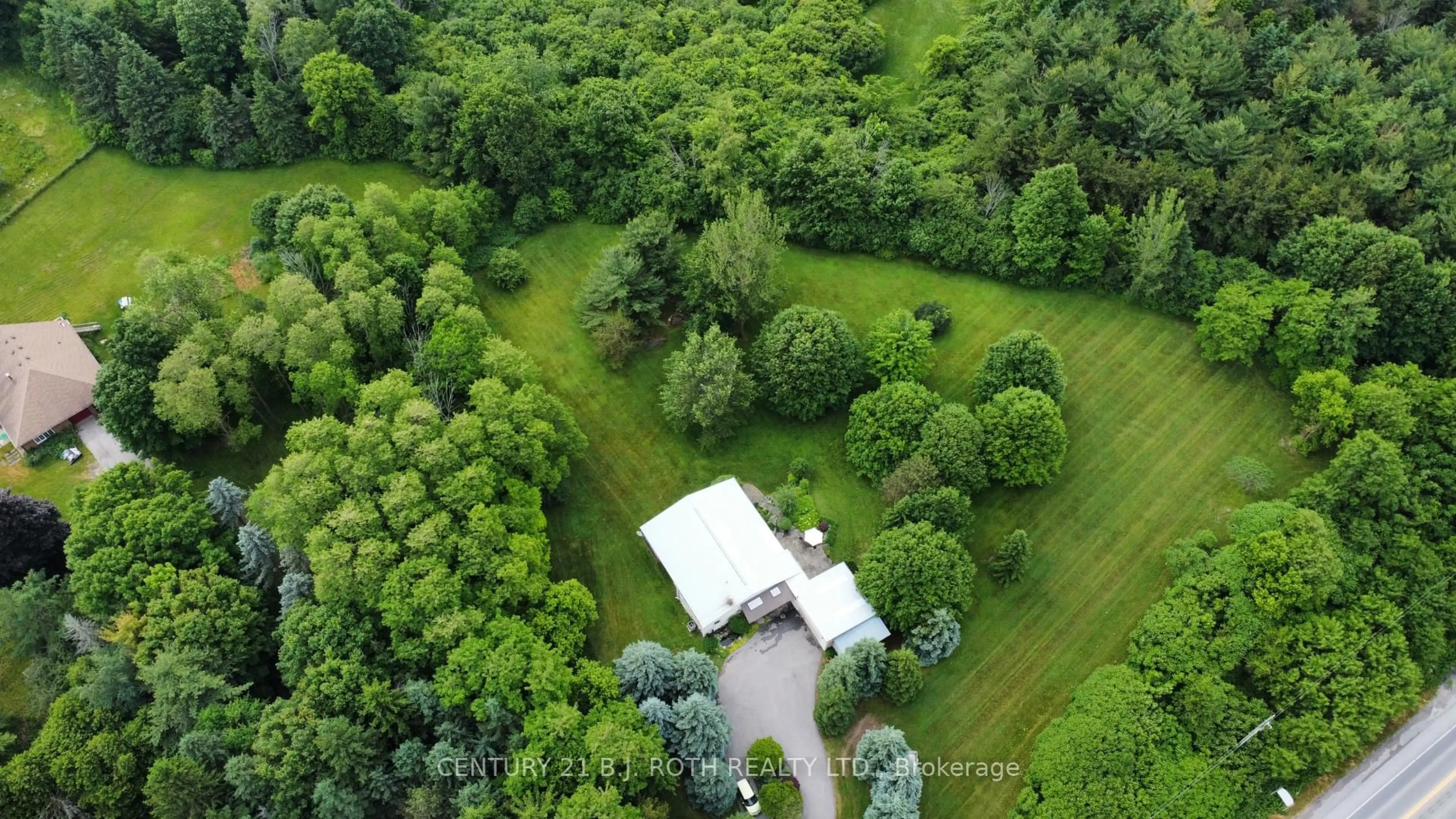 A pic from outside/outdoor area/front of a property/back of a property/a pic from drone, forest/trees view for 1131 Brock Rd, Uxbridge Ontario L9P 1R4