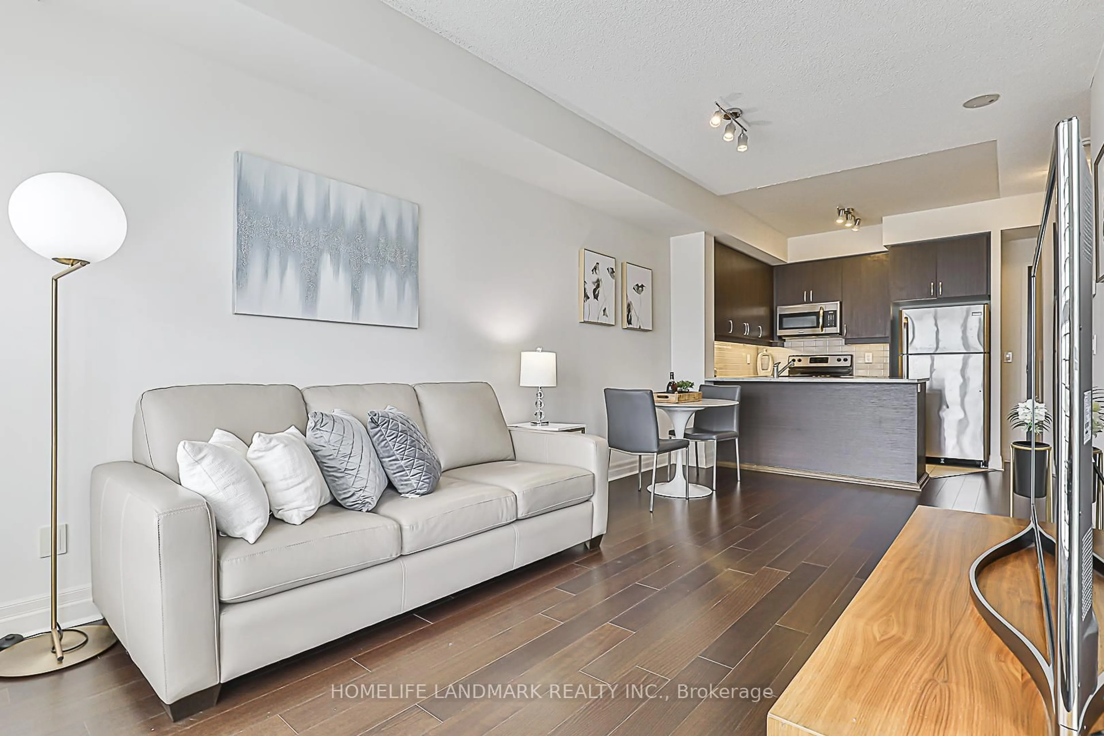Living room with furniture, wood/laminate floor for 8110 Birchmount Rd #1102, Markham Ontario L6G 0E3