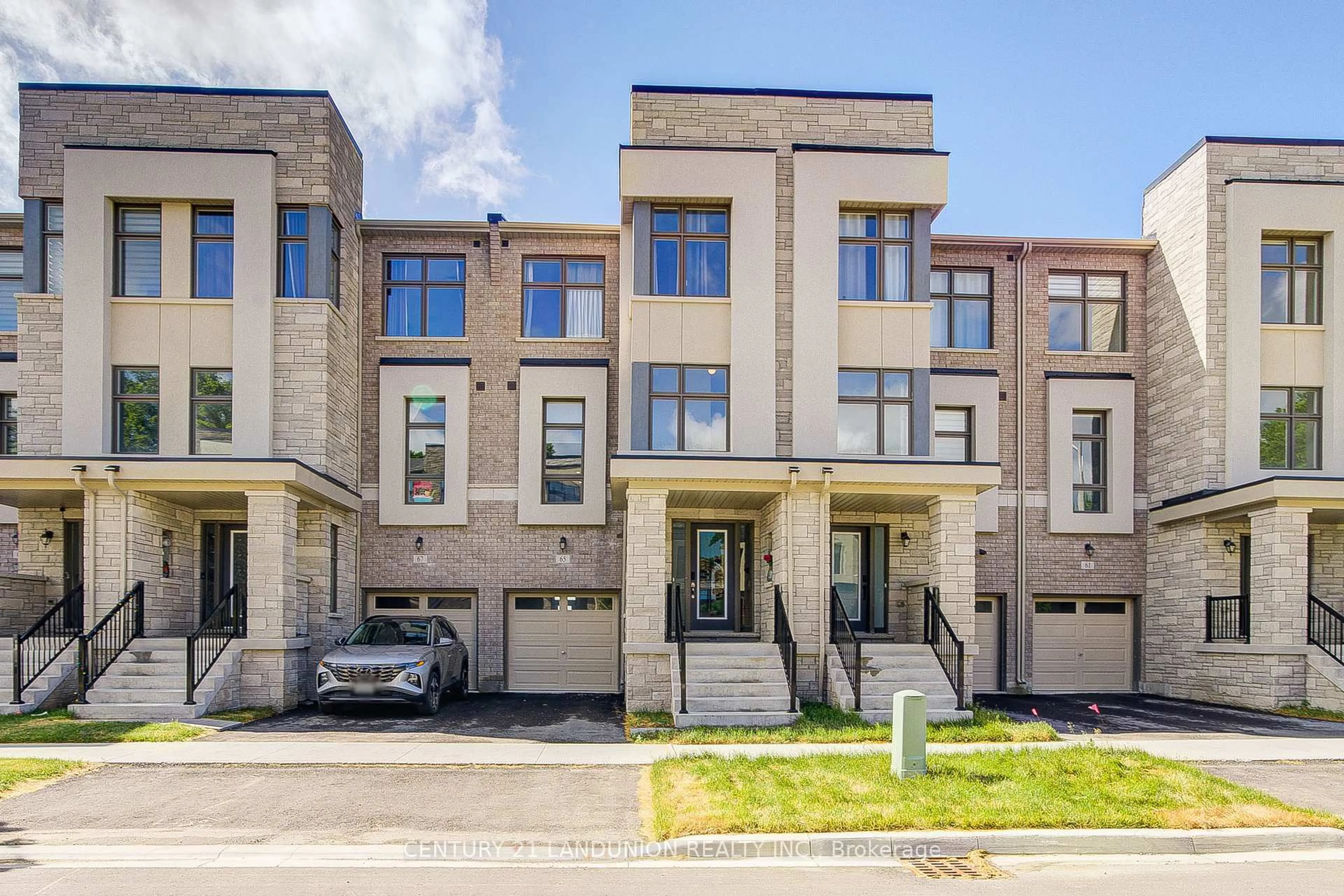 Home with brick exterior material, street for 65 Puisaya Dr, Richmond Hill Ontario L4E 1L2