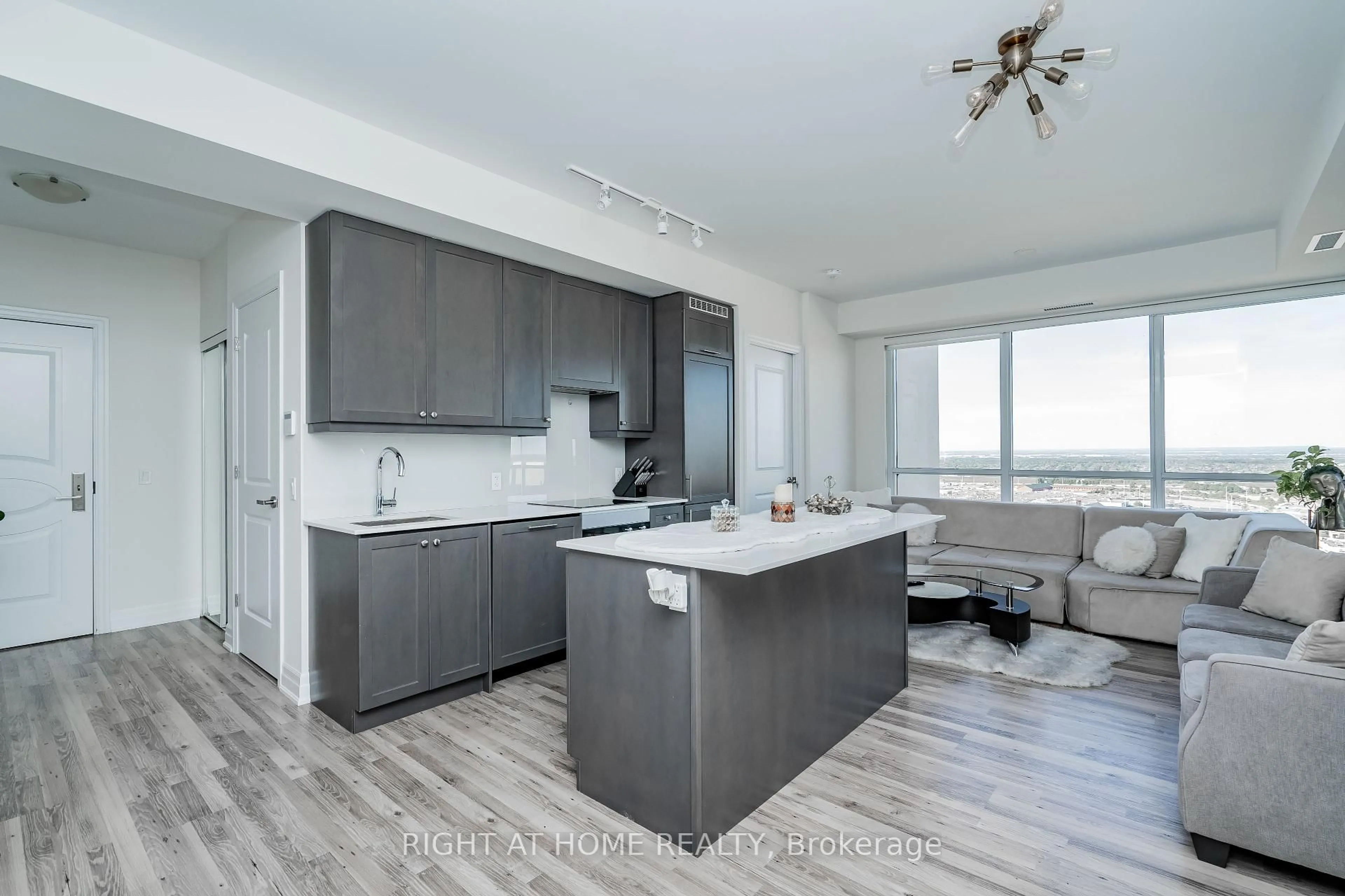 Open concept kitchen, wood/laminate floor for 9075 Jane St #2309, Vaughan Ontario L4K 0L7