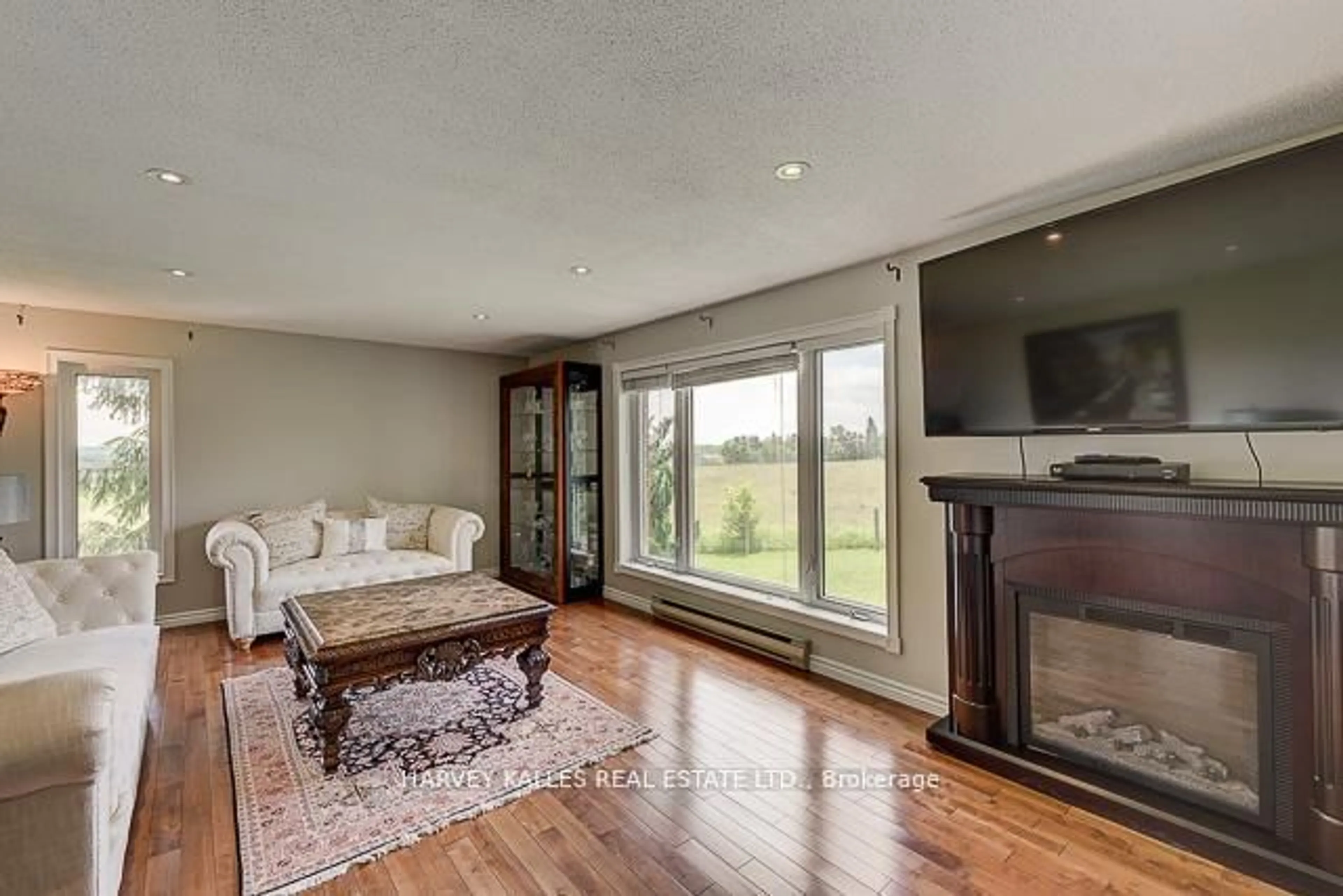Living room with furniture, wood/laminate floor for 3327 County Rd 50, Adjala-Tosorontio Ontario L0G 1L0